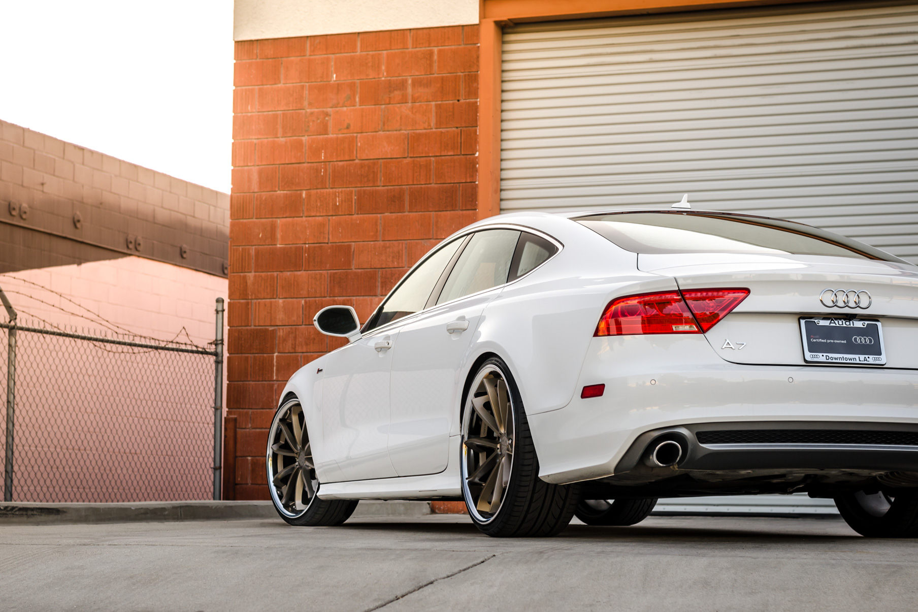 A White 2016 Audi A7 on 20 Inch Blaque Diamond BD-23 Bronze with Chrome SS Lip Wheels