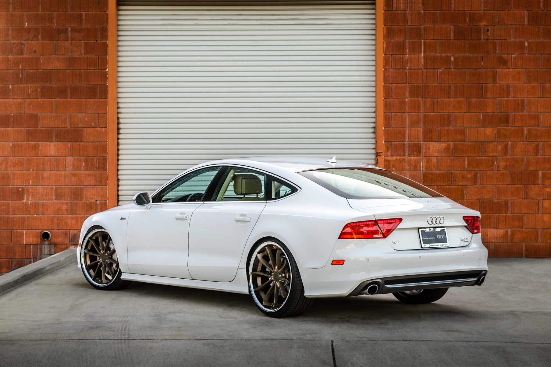 A White 2016 Audi A7 on 20 Inch Blaque Diamond BD-23 Bronze with Chrome SS Lip Wheels