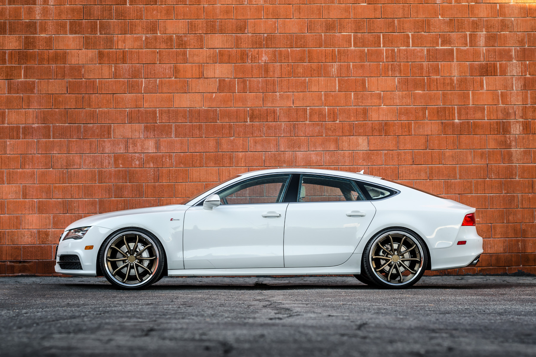 A White 2016 Audi A7 on 20 Inch Blaque Diamond BD-23 Bronze with Chrome SS Lip Wheels