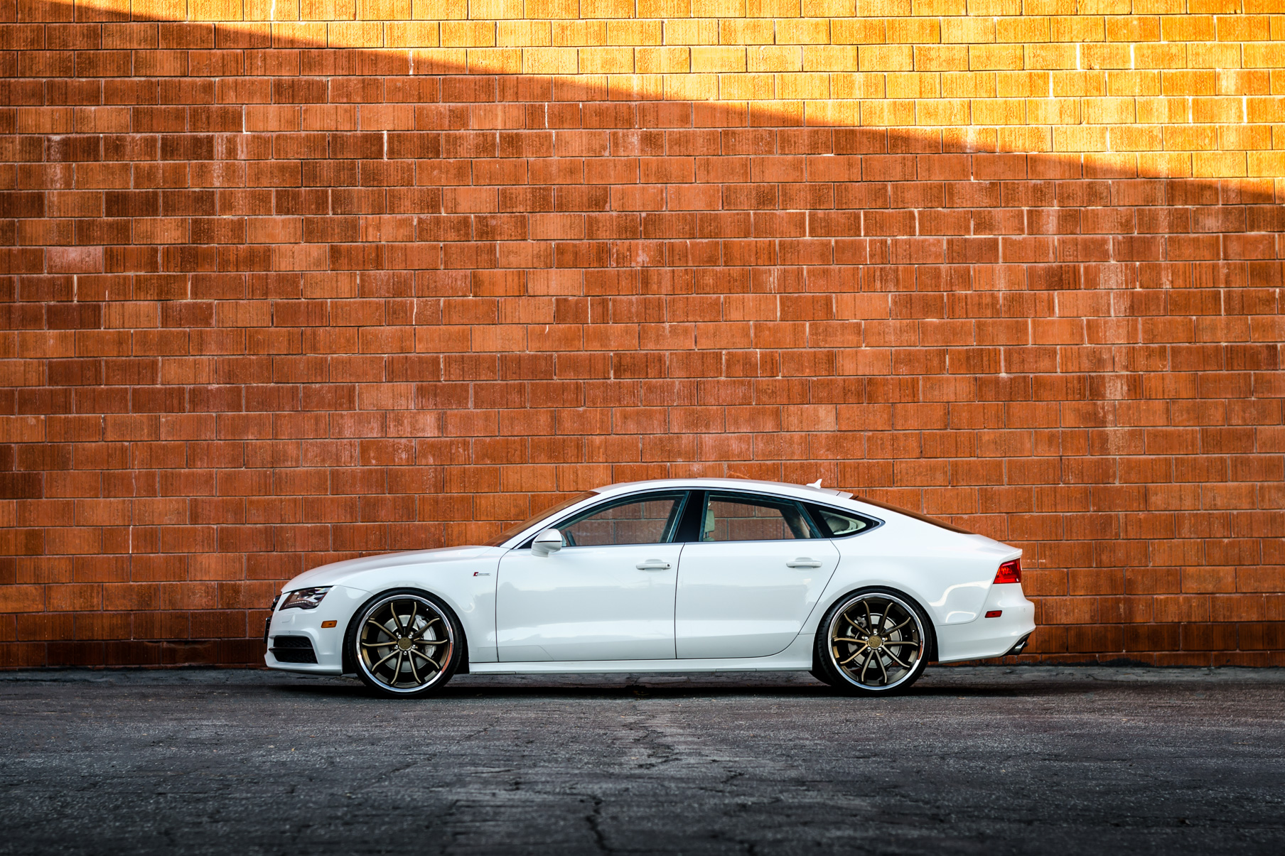 A White 2016 Audi A7 on 20 Inch Blaque Diamond BD-23 Bronze with Chrome SS Lip Wheels