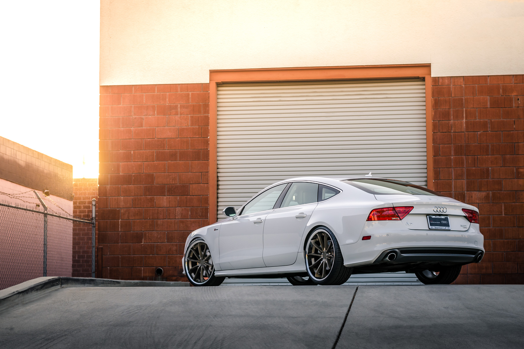 A White 2016 Audi A7 on 20 Inch Blaque Diamond BD-23 Bronze with Chrome SS Lip Wheels