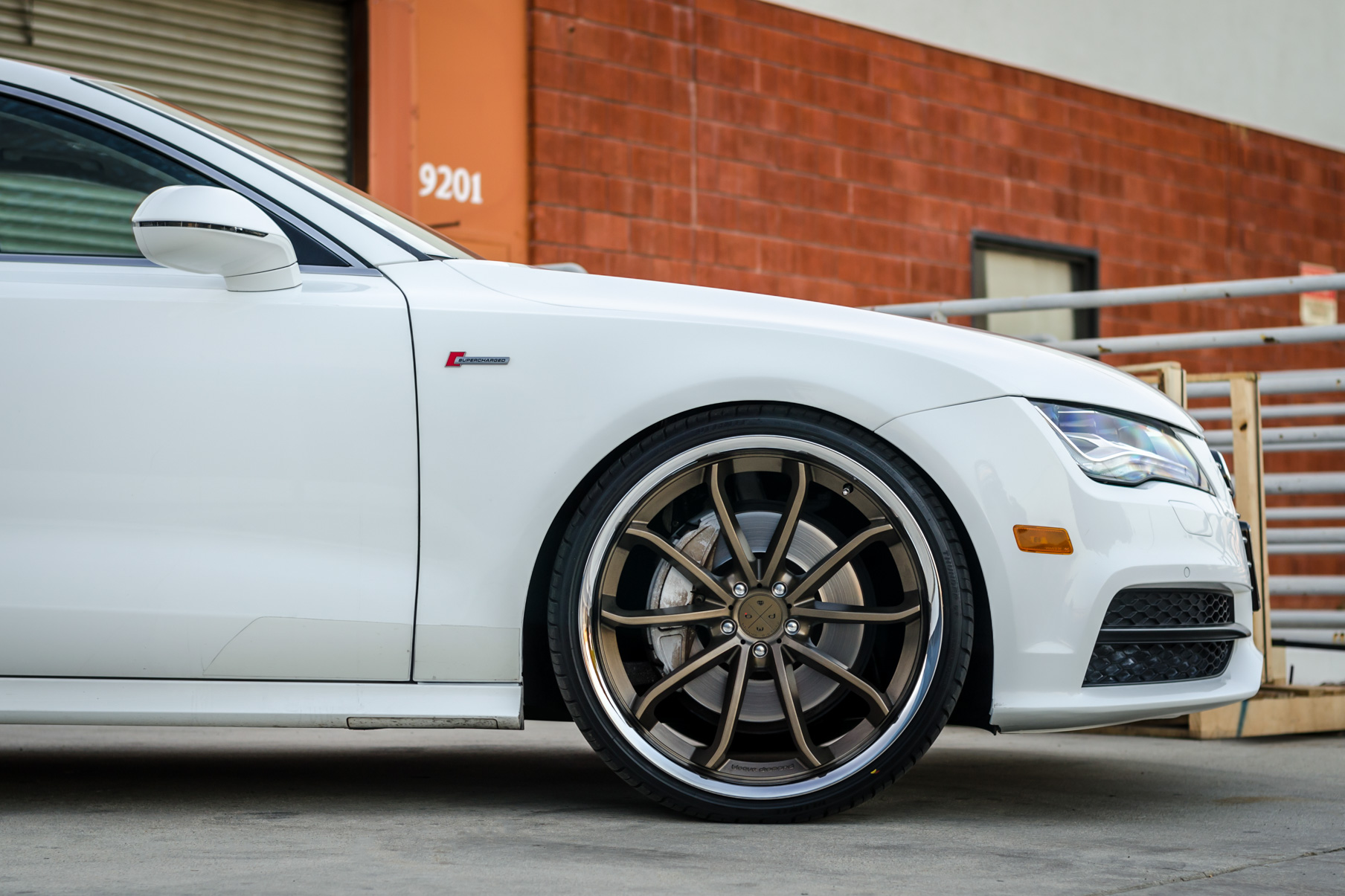 A White 2016 Audi A7 on 20 Inch Blaque Diamond BD-23 Bronze with Chrome SS Lip Wheels