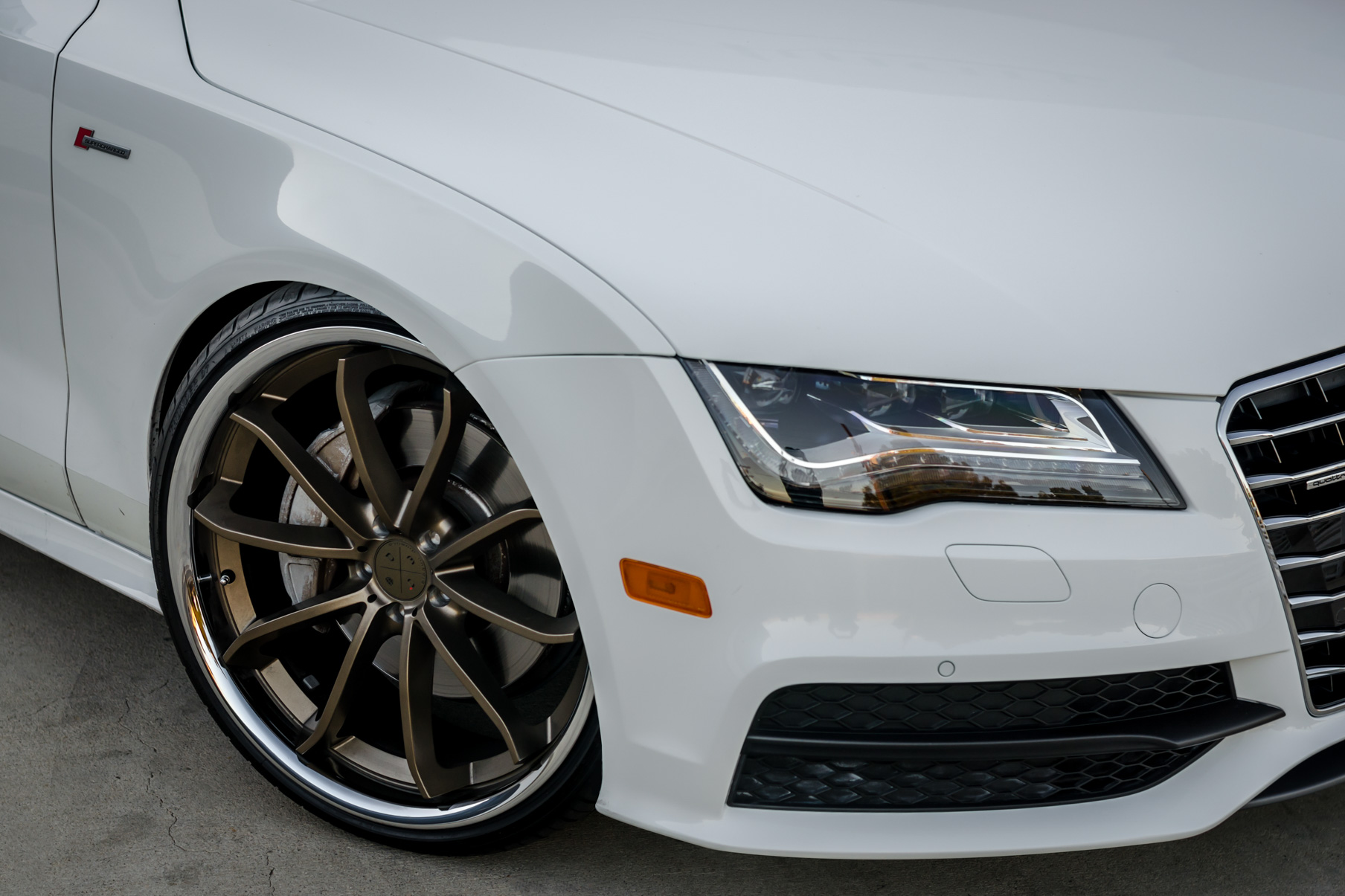 A White 2016 Audi A7 on 20 Inch Blaque Diamond BD-23 Bronze with Chrome SS Lip Wheels