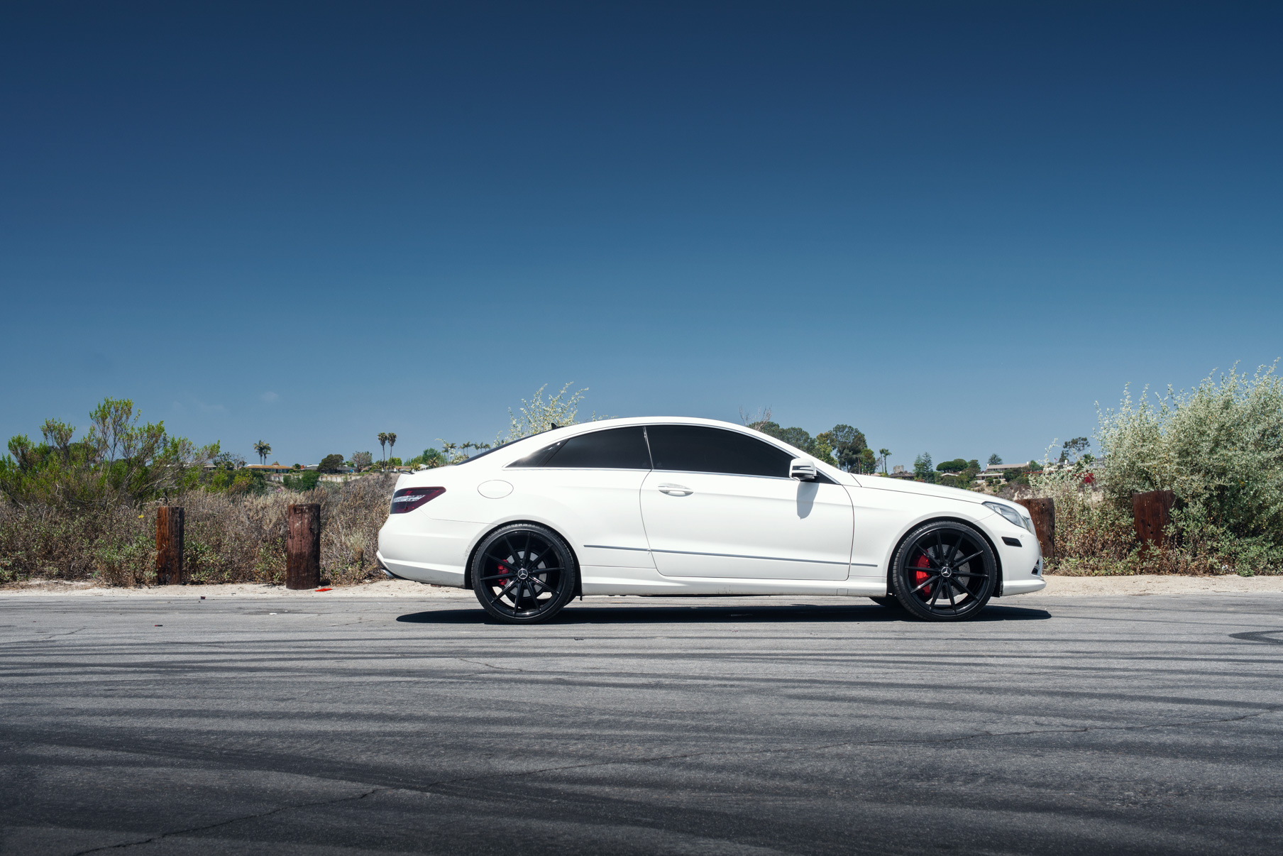 A 2015 Mercedes-Benz E550 on 20 Inch Blaque Diamond BD-11 Gloss Black Wheels
