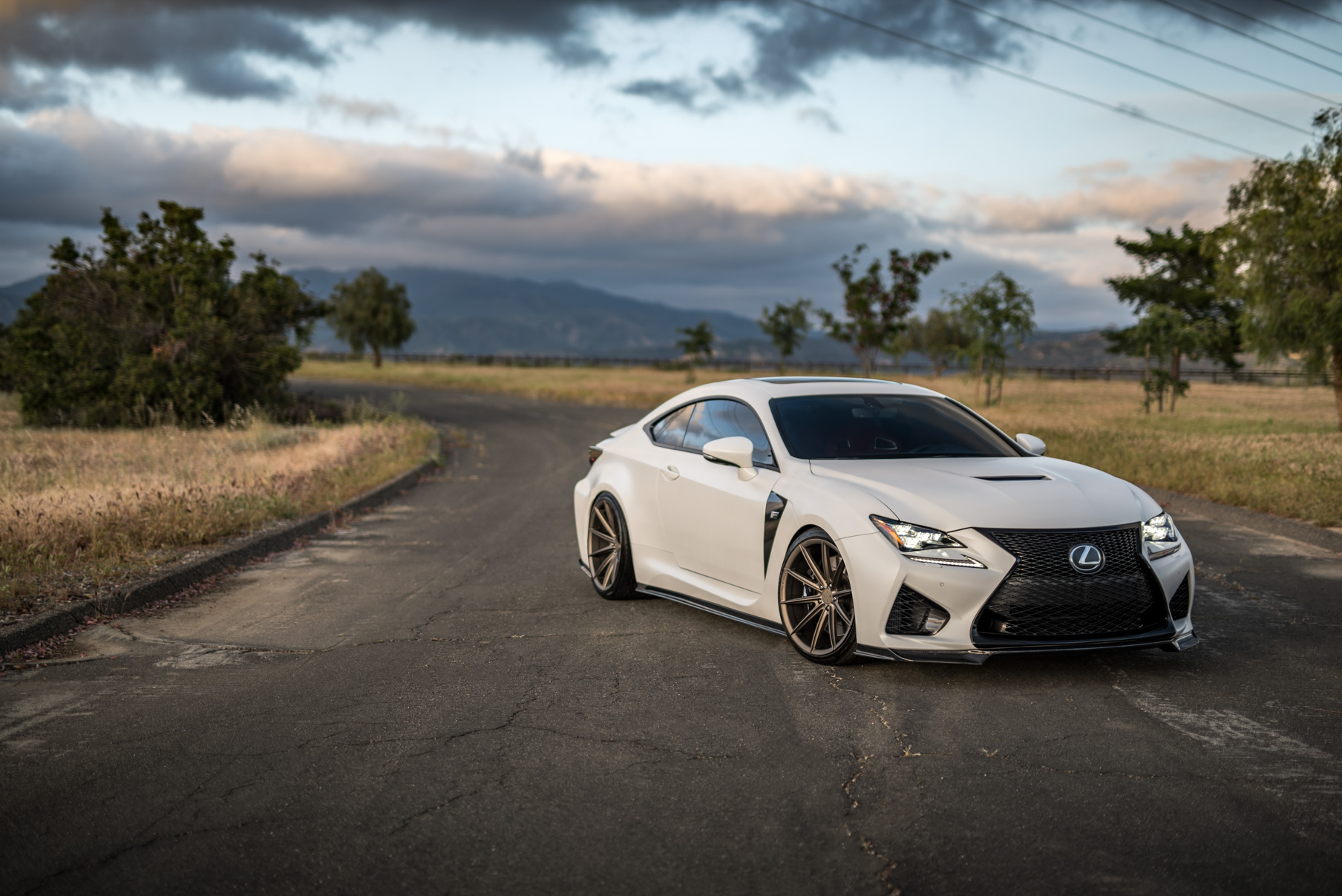 A White 2016 Lexus RCF on 20 Inch Blaque Diamond BD-11 Polished Rose Gold Wheels