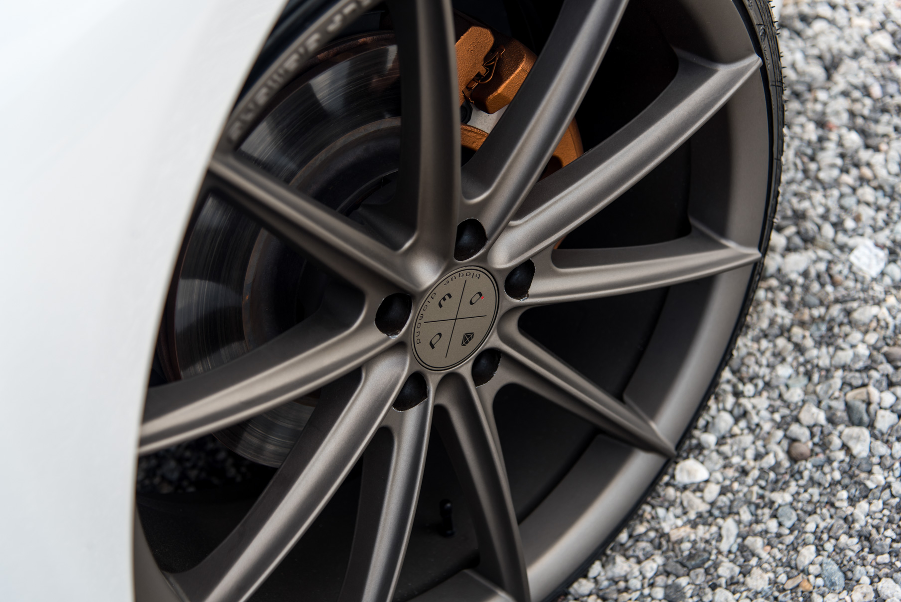 A 2015 Infiniti Q50 on 20 Inch Blaque Diamond BD-11 Matte Antique Bronze Wheels