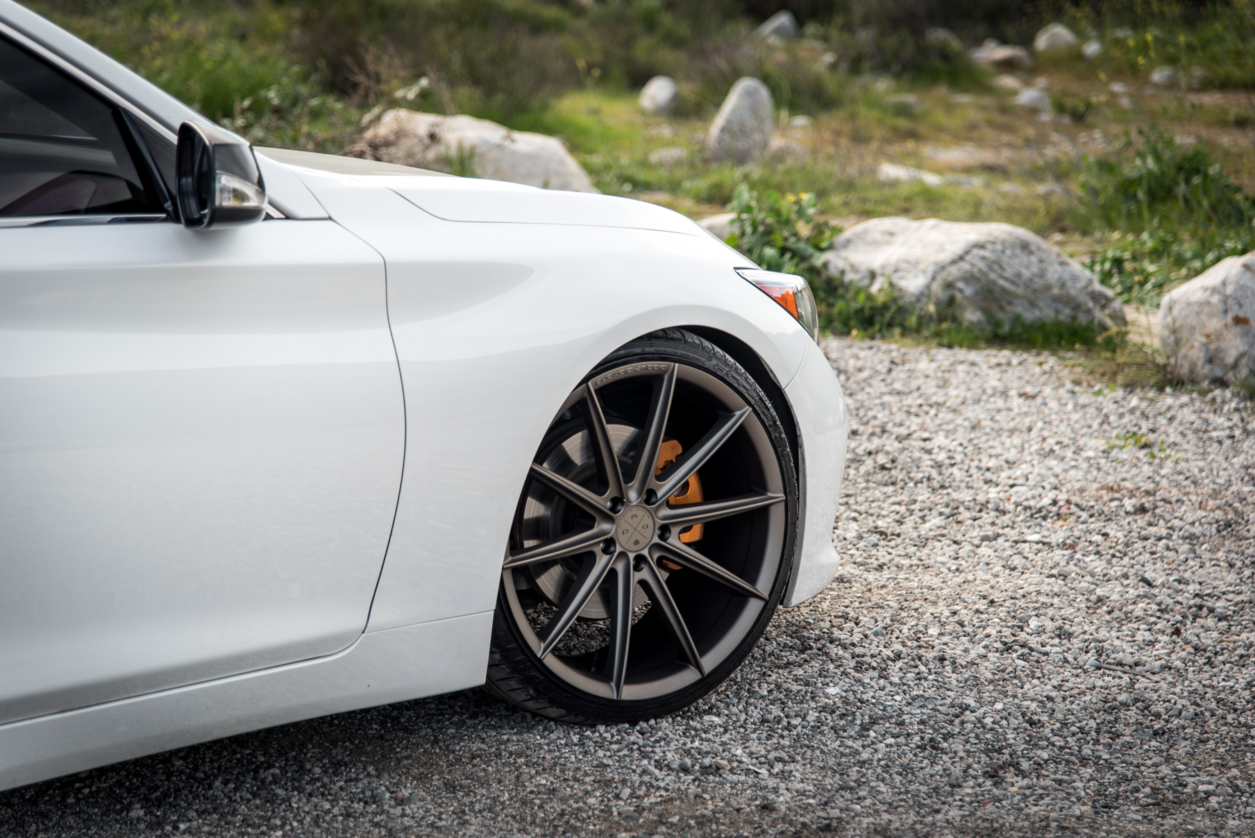 A 2015 Infiniti Q50 on 20 Inch Blaque Diamond BD-11 Matte Antique Bronze Wheels