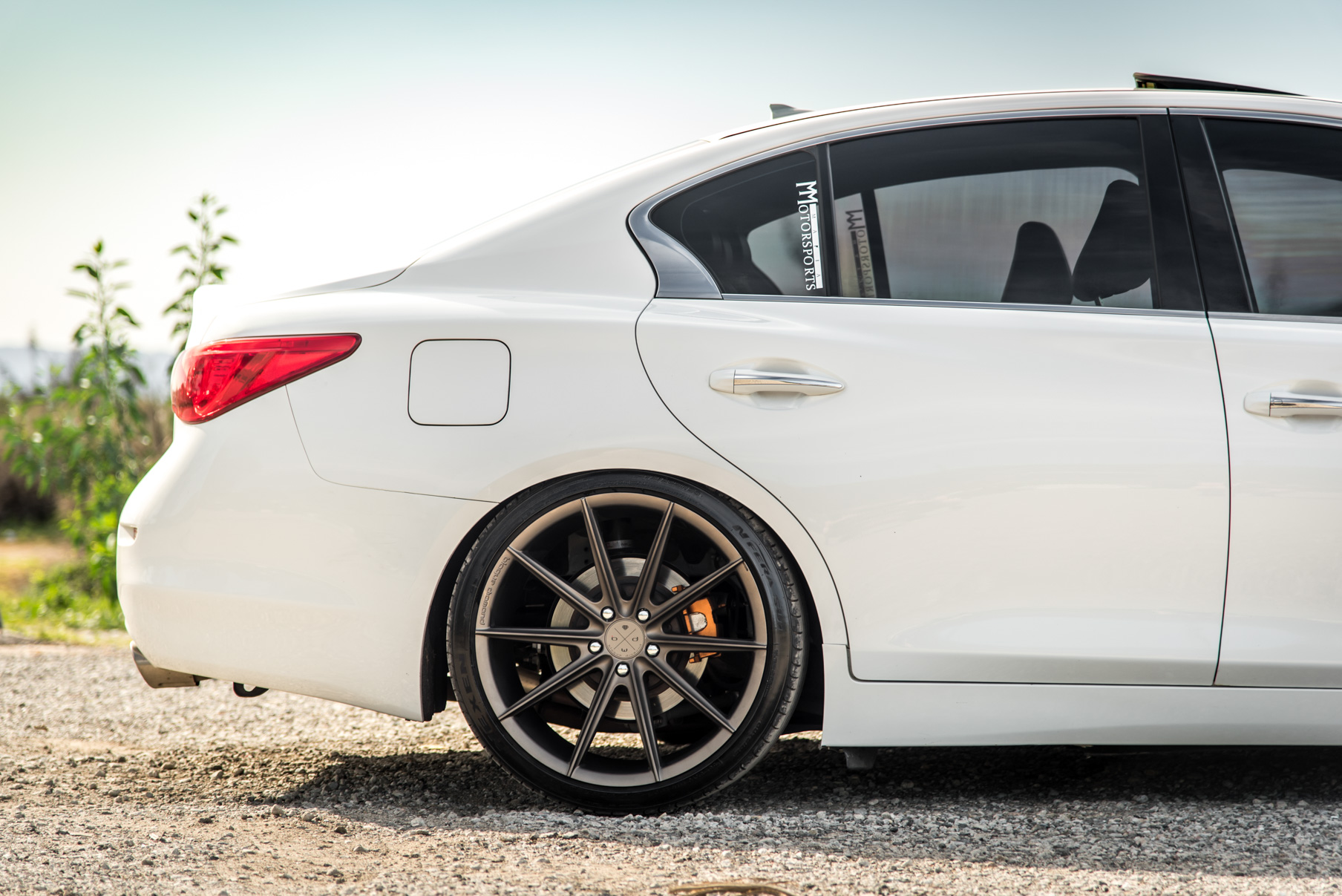 A 2015 Infiniti Q50 on 20 Inch Blaque Diamond BD-11 Matte Antique Bronze Wheels