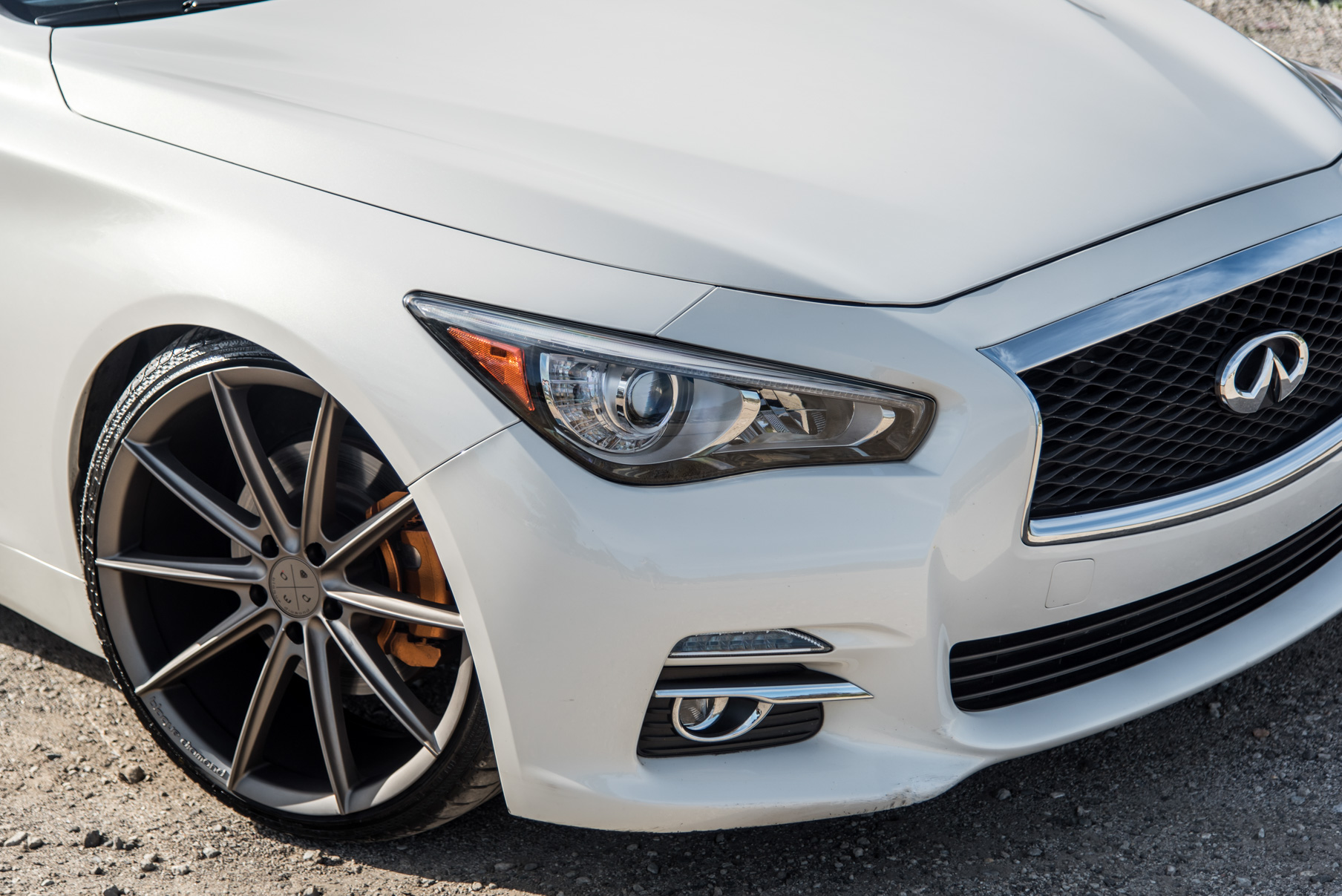A 2015 Infiniti Q50 on 20 Inch Blaque Diamond BD-11 Matte Antique Bronze Wheels