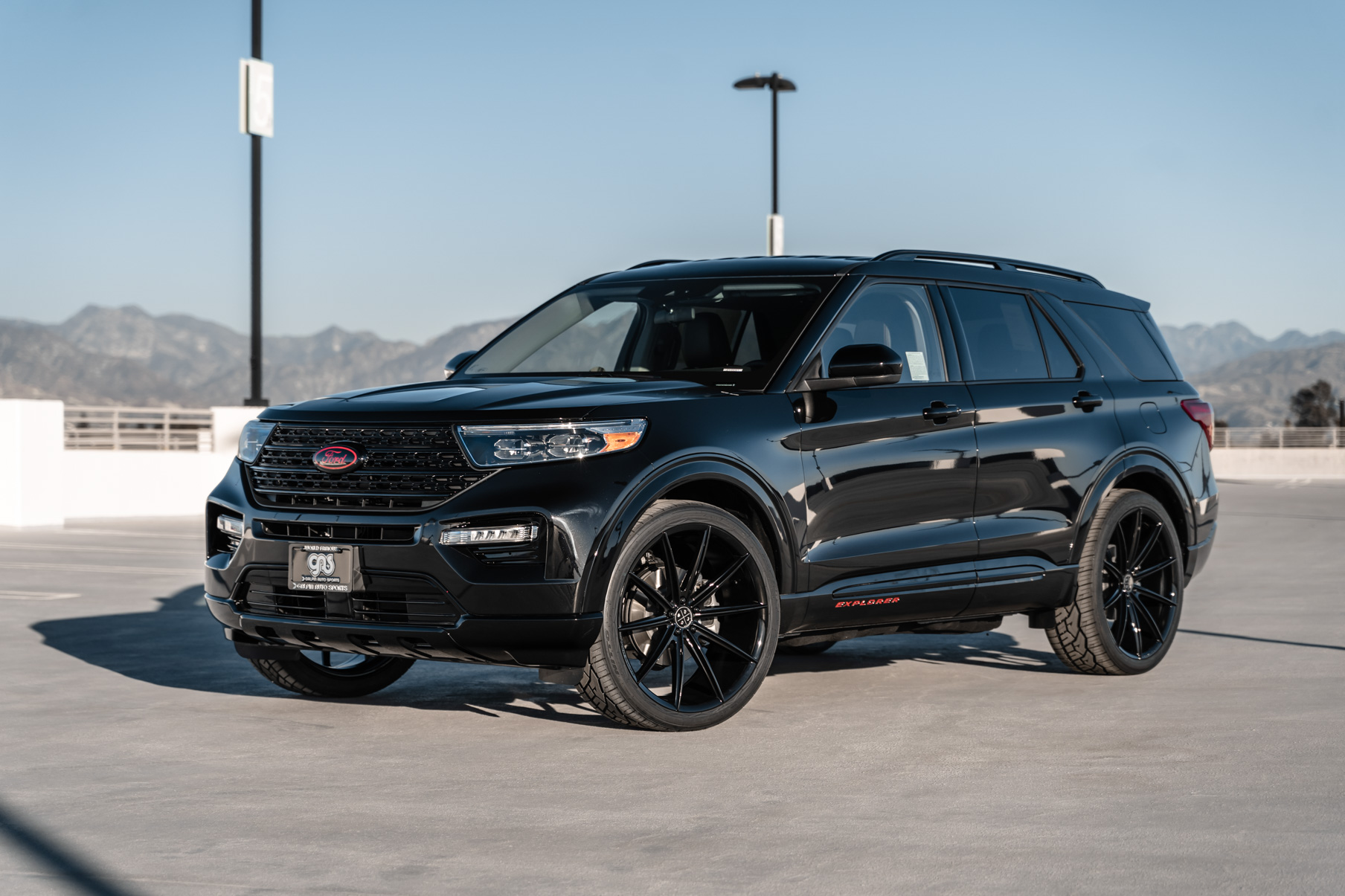 A 2021 Ford Explorer on 24 Inch Blaque Diamond BD-11 Gloss Black Wheels