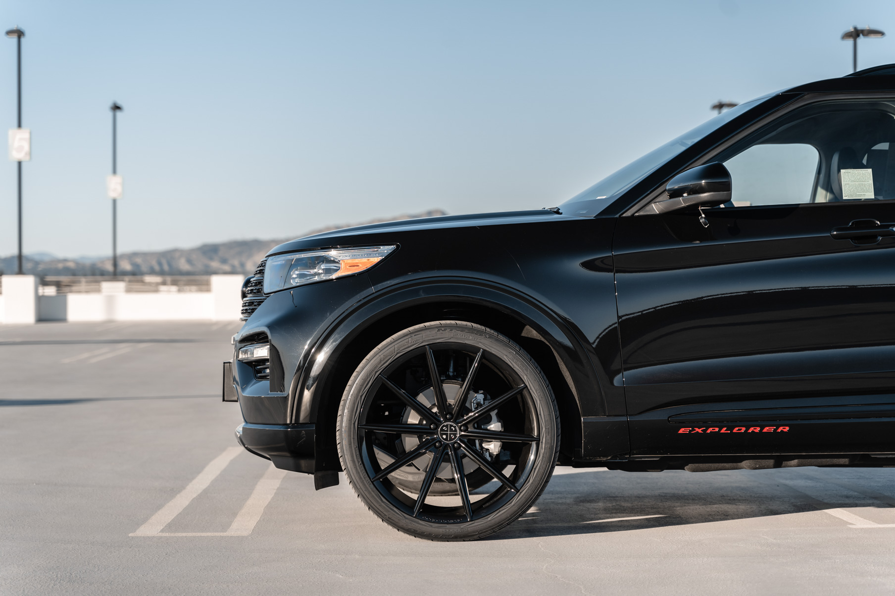 A 2021 Ford Explorer on 24 Inch Blaque Diamond BD-11 Gloss Black Wheels