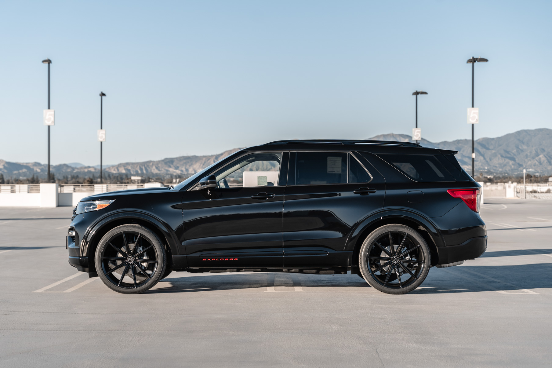 A 2021 Ford Explorer on 24 Inch Blaque Diamond BD-11 Gloss Black Wheels