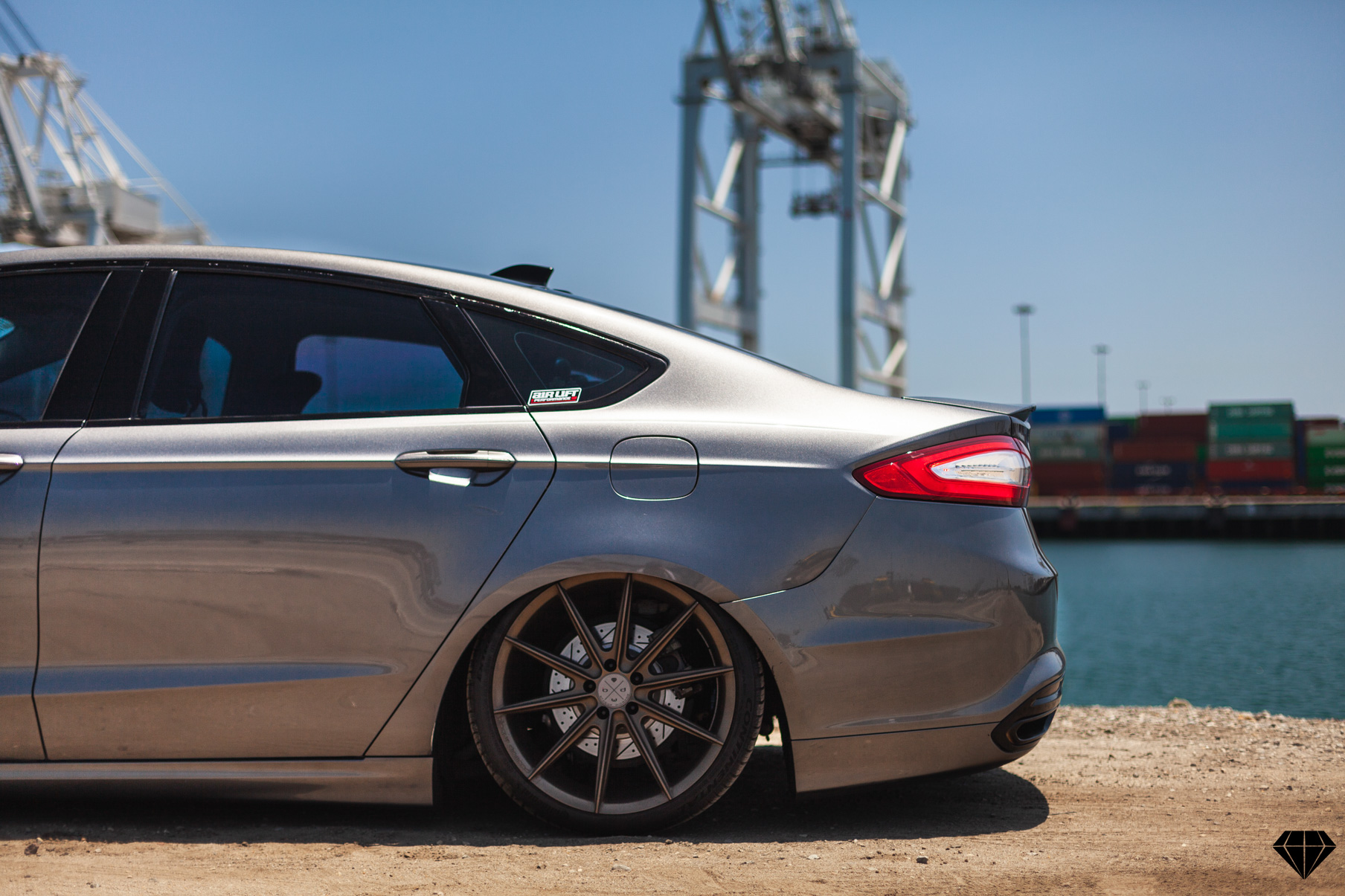 A 2013 Ford Fusion on 19 Inch Blaque Diamond BD-11 Gloss Black Wheels