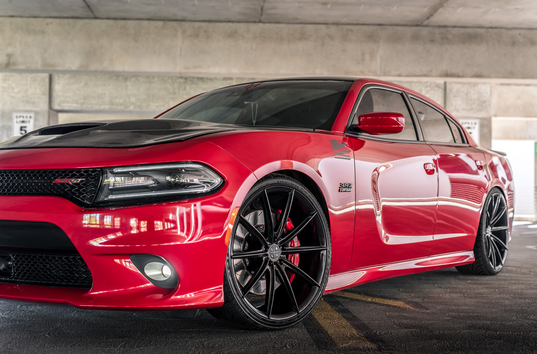 A 2016 Dodge Charger SRT on Blaque Diamond BD-11 Gloss Black Wheels