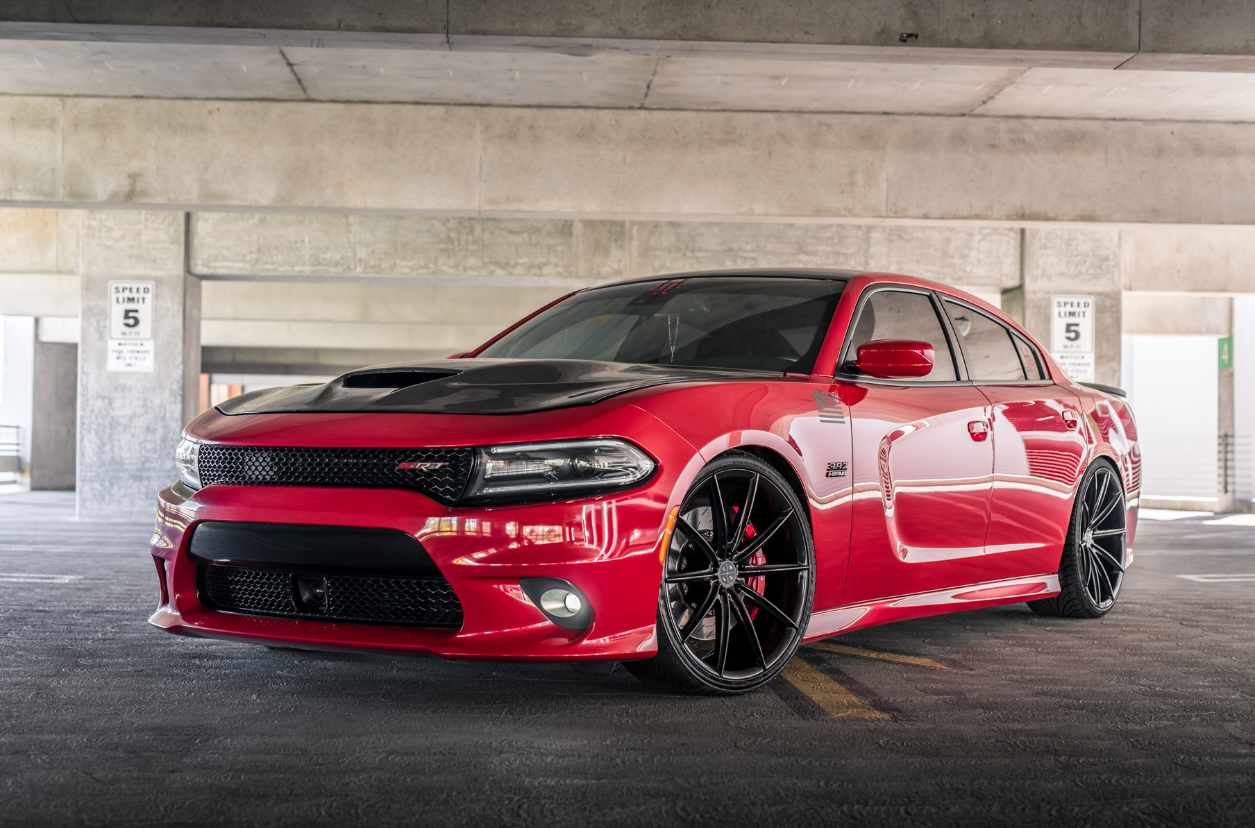A 2016 Dodge Charger SRT on Blaque Diamond BD-11 Gloss Black Wheels