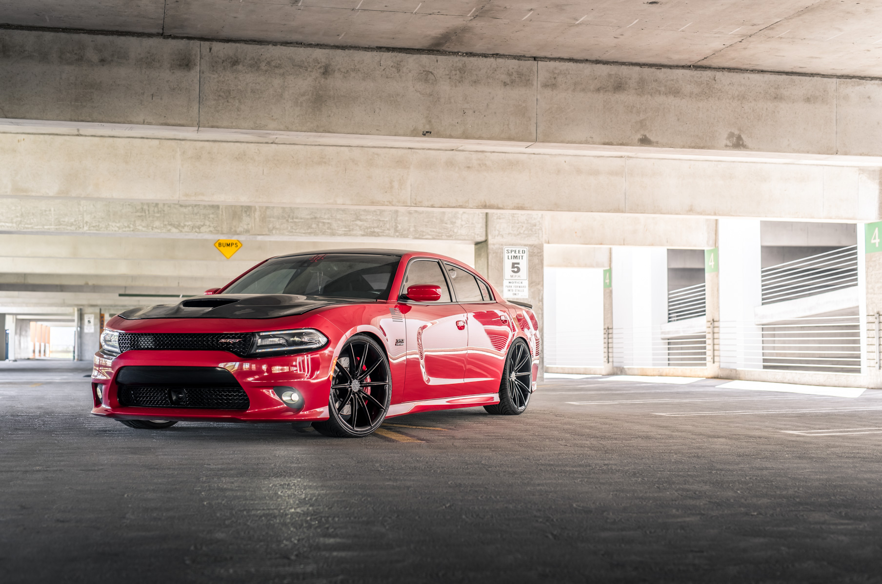 A 2016 Dodge Charger SRT on Blaque Diamond BD-11 Gloss Black Wheels