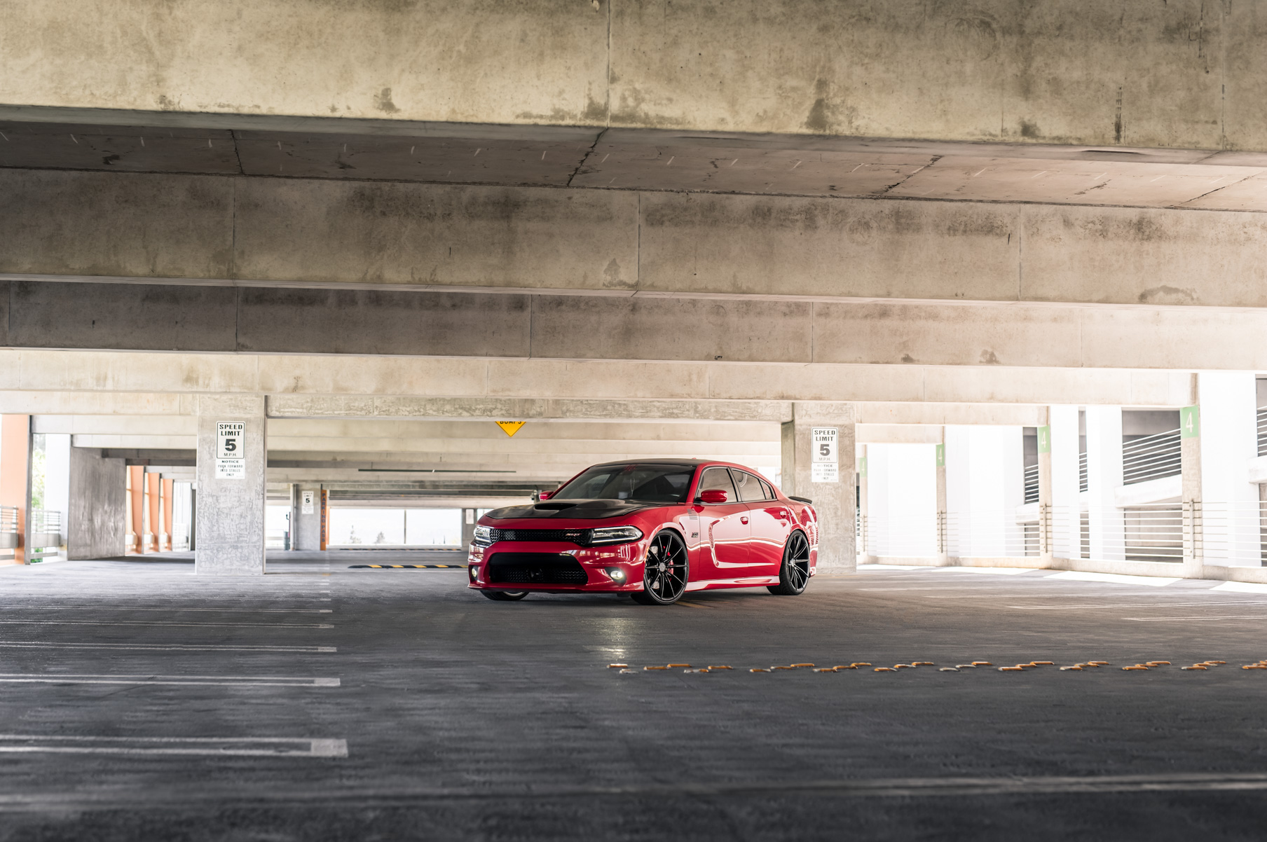 A 2016 Dodge Charger SRT on Blaque Diamond BD-11 Gloss Black Wheels