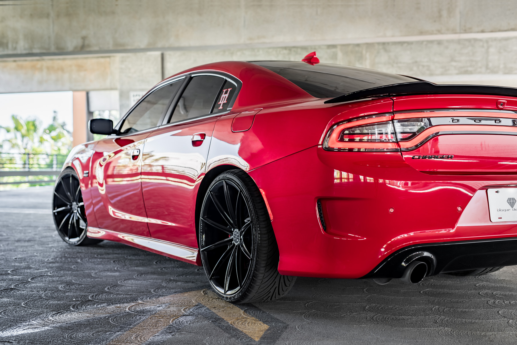 A 2016 Dodge Charger SRT on Blaque Diamond BD-11 Gloss Black Wheels