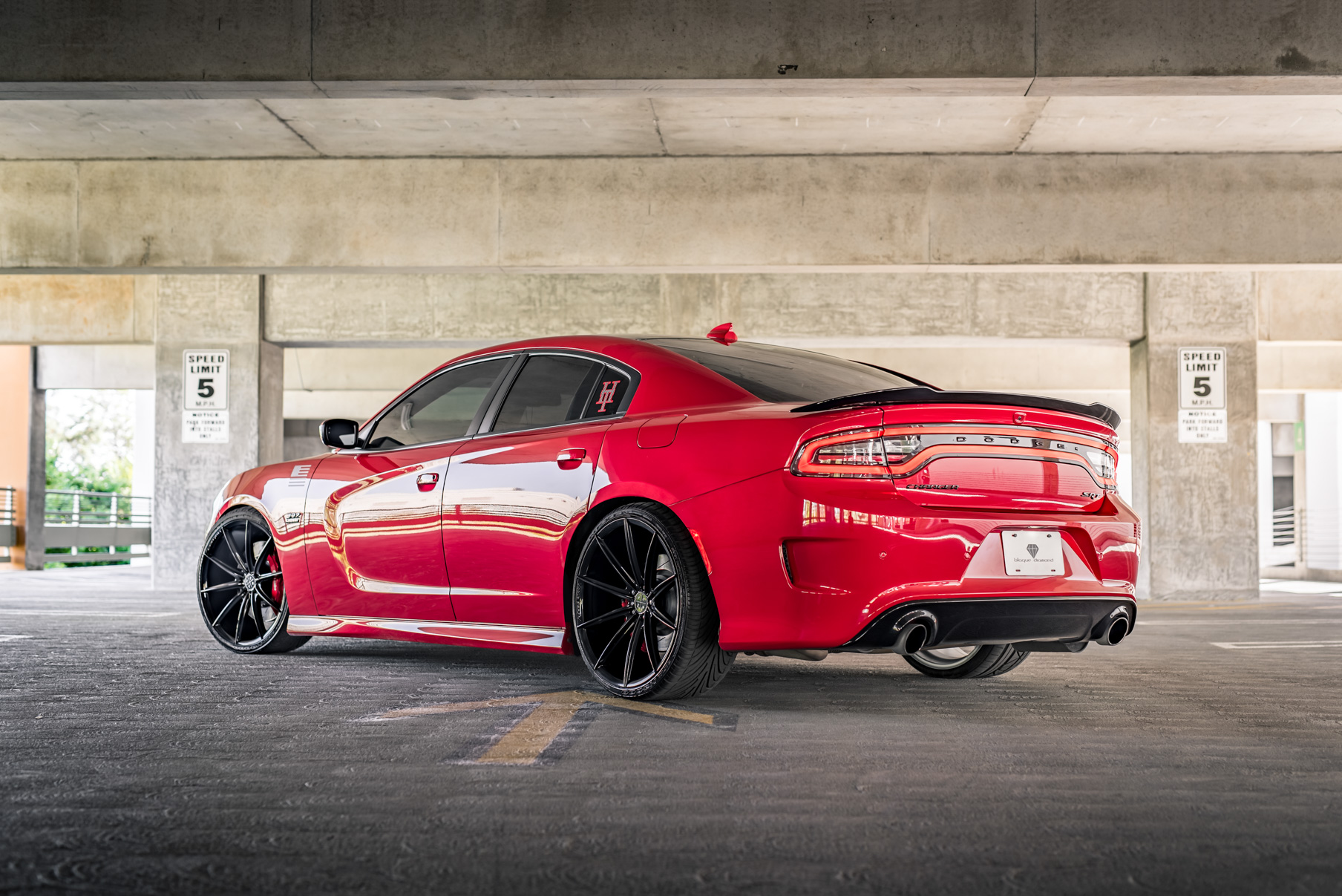 A 2016 Dodge Charger SRT on Blaque Diamond BD-11 Gloss Black Wheels
