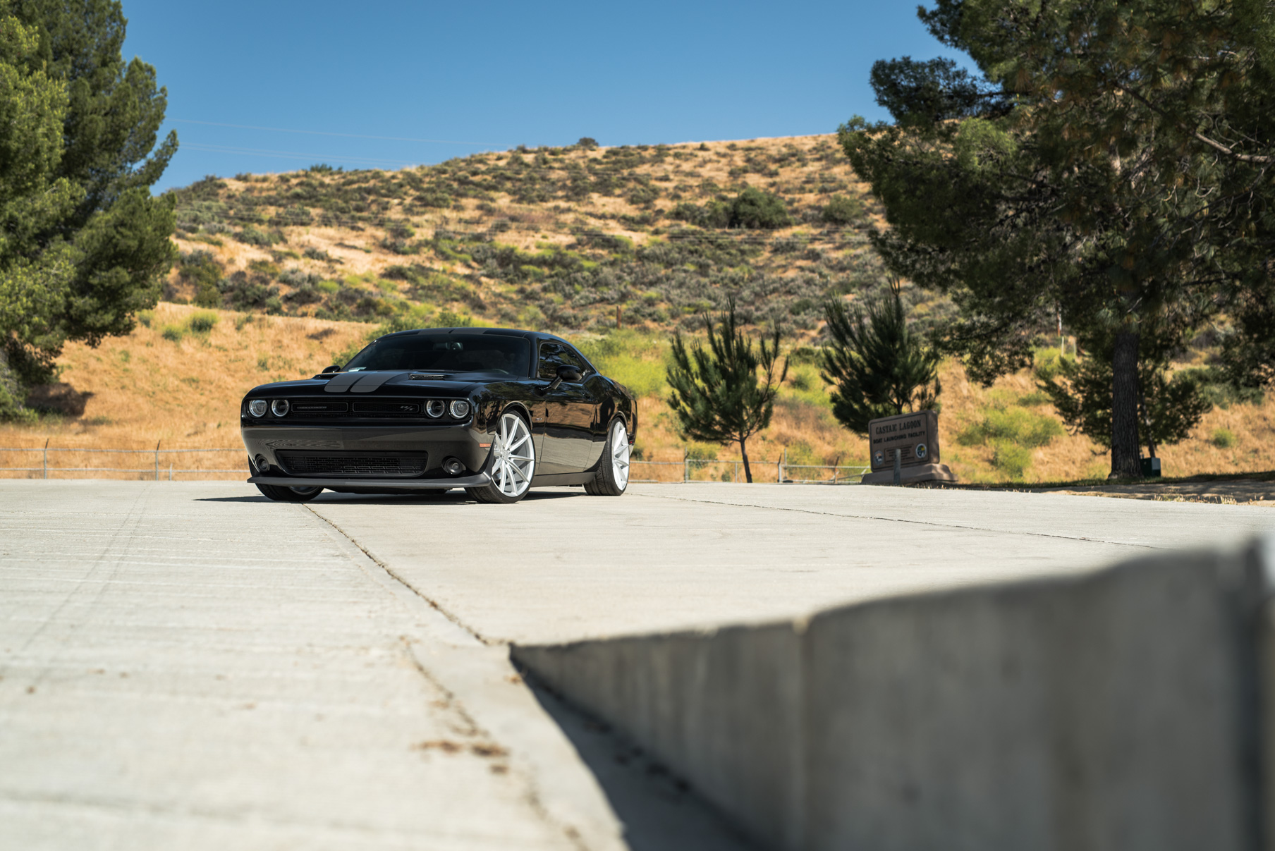 A 2016 Dodge Charger SRT on 22 Inch Blaque Diamond BD-11 Frozen Silver Wheels