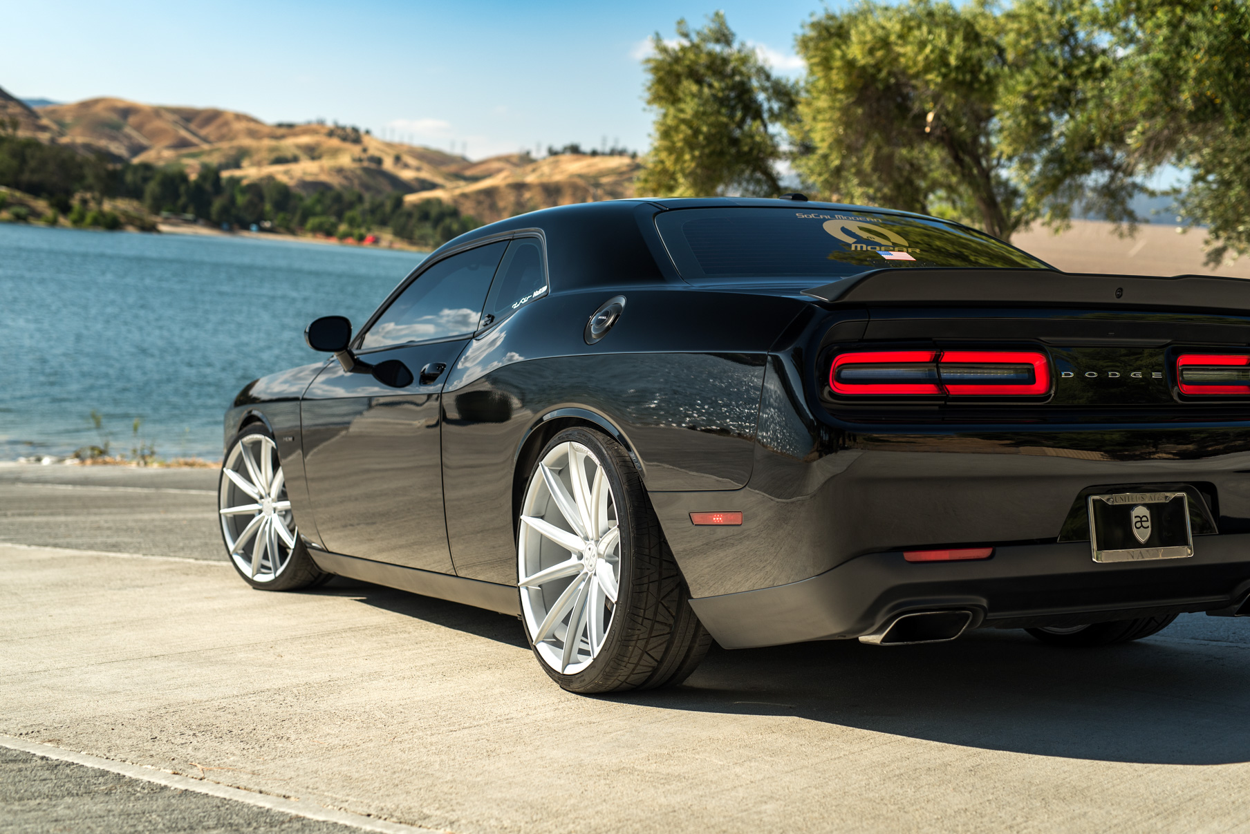 A 2016 Dodge Charger SRT on 22 Inch Blaque Diamond BD-11 Frozen Silver Wheels