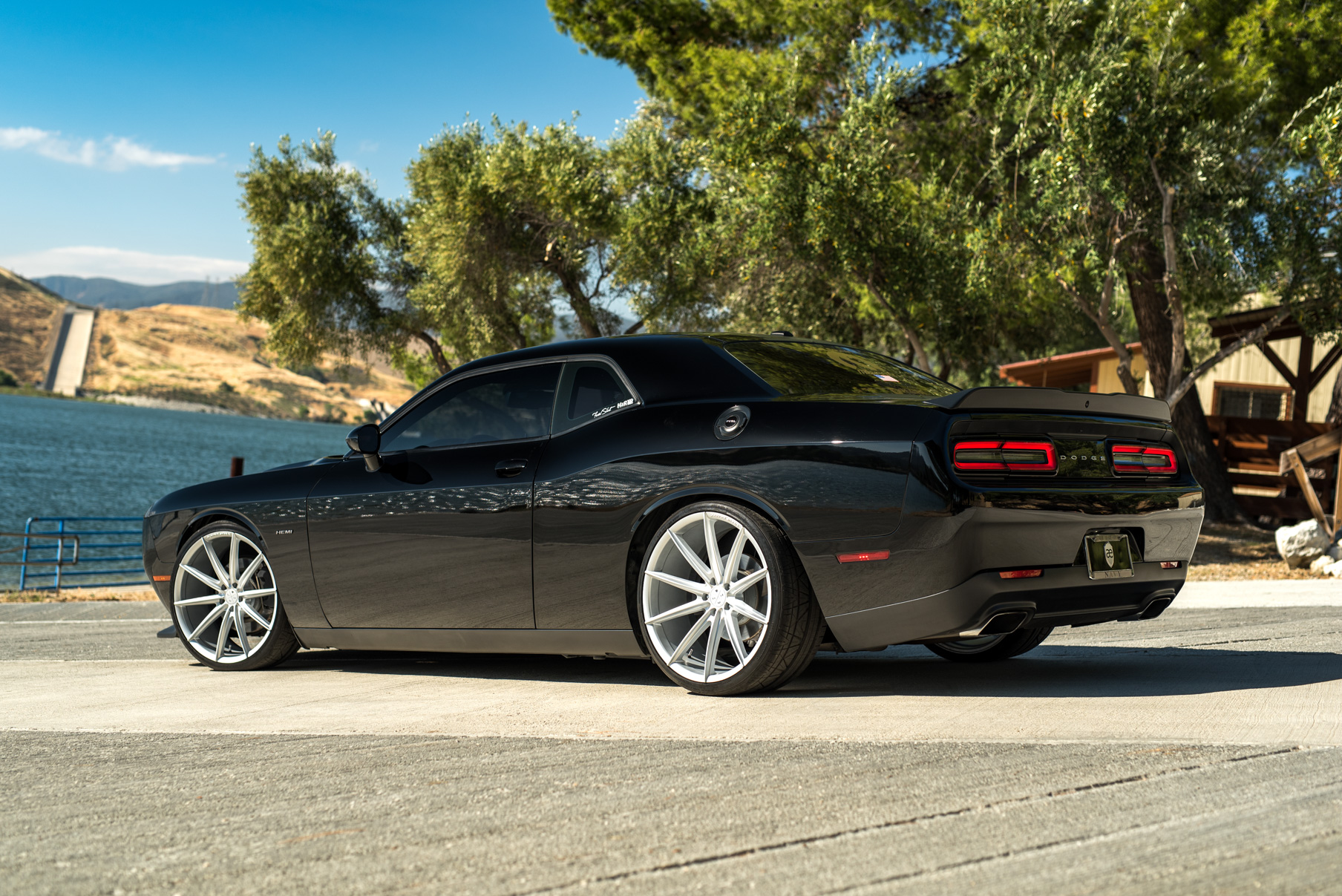 A 2016 Dodge Charger SRT on 22 Inch Blaque Diamond BD-11 Frozen Silver Wheels
