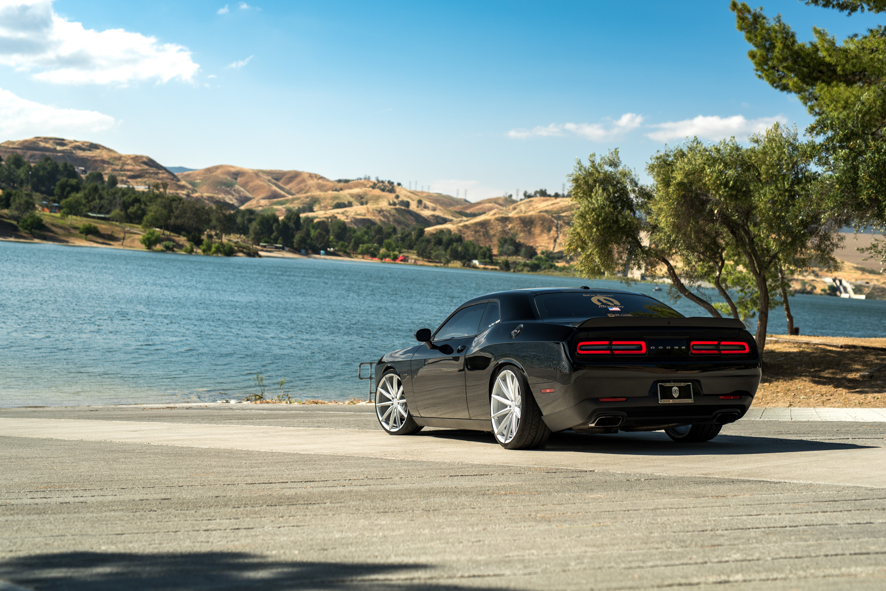 A 2016 Dodge Charger SRT on 22 Inch Blaque Diamond BD-11 Frozen Silver Wheels