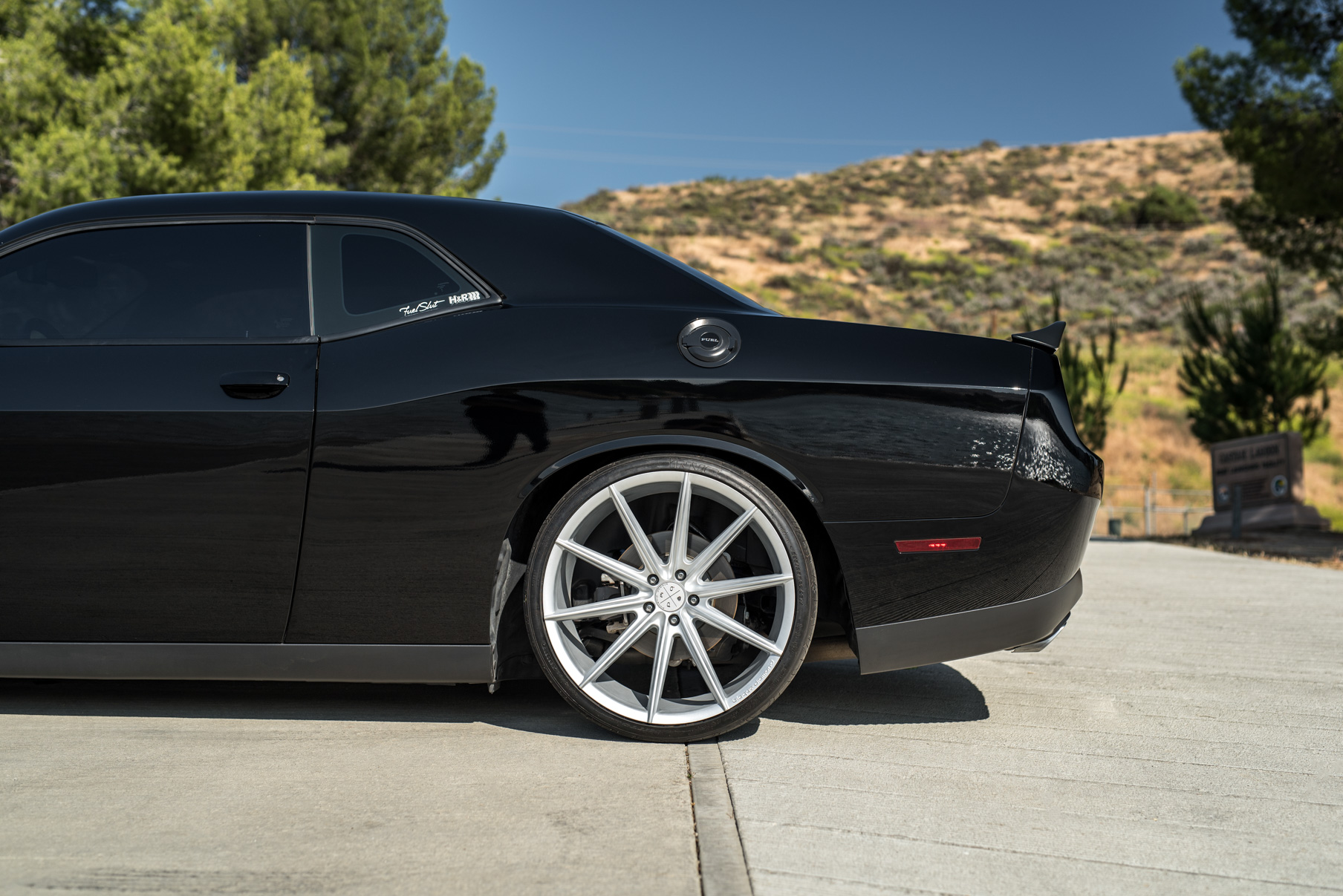 A 2016 Dodge Charger SRT on 22 Inch Blaque Diamond BD-11 Frozen Silver Wheels