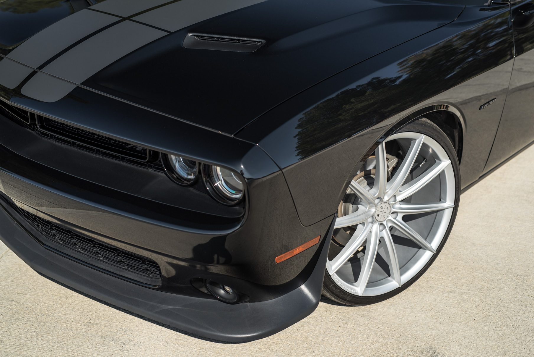 A 2016 Dodge Charger SRT on 22 Inch Blaque Diamond BD-11 Frozen Silver Wheels