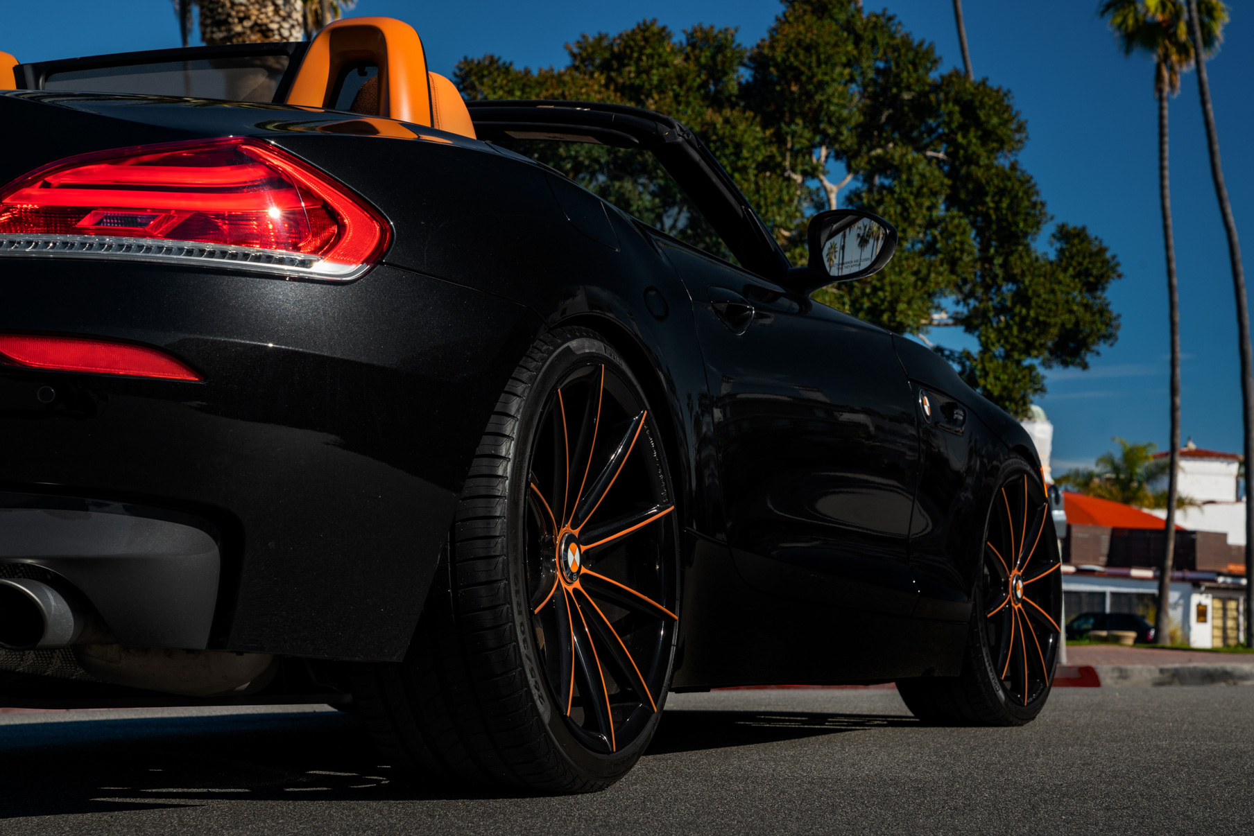 A 2018 BMW Z4 on 20 Inch Blaque Diamond BD-11 Orange Black Wheels