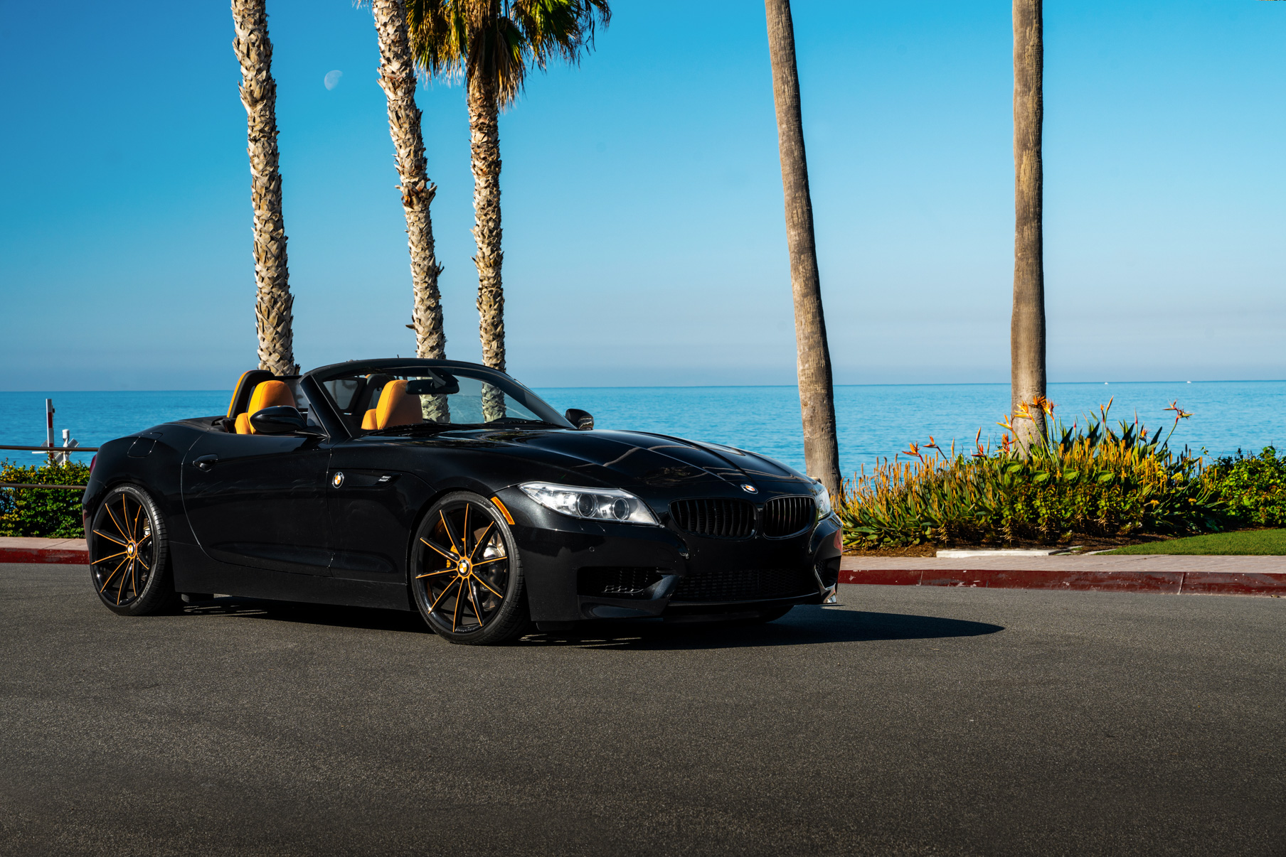 A 2018 BMW Z4 on 20 Inch Blaque Diamond BD-11 Orange Black Wheels