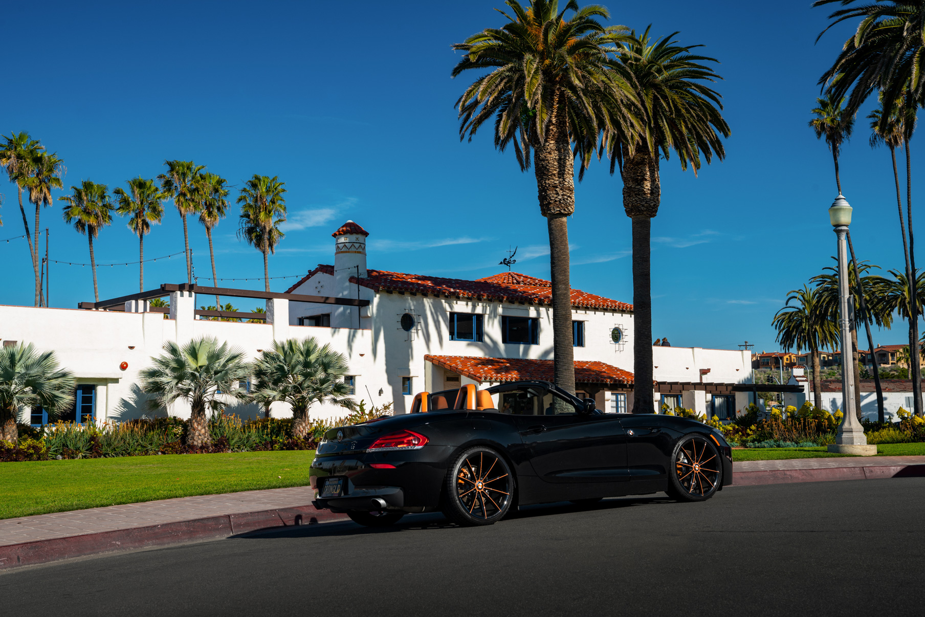 A 2018 BMW Z4 on 20 Inch Blaque Diamond BD-11 Orange Black Wheels