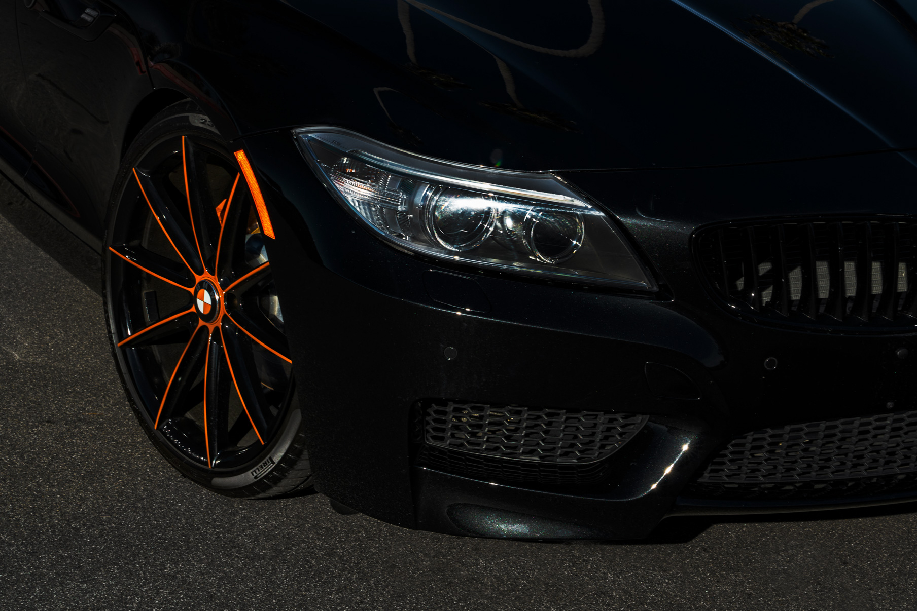 A 2018 BMW Z4 on 20 Inch Blaque Diamond BD-11 Orange Black Wheels