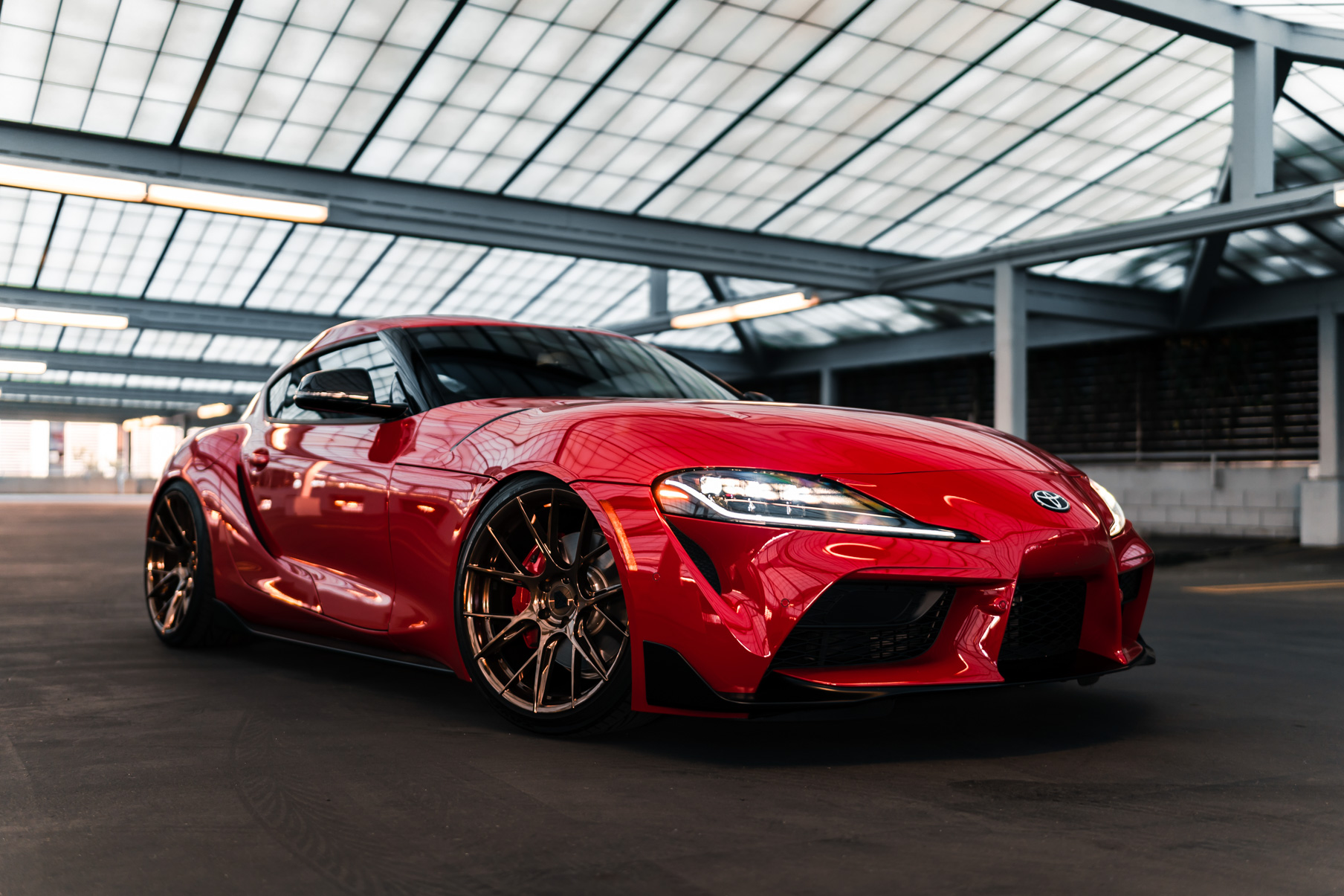 A 2020 Toyota Supra on Blaque Diamond BD-F18 Polished Bronze Little Tokyo Wheels