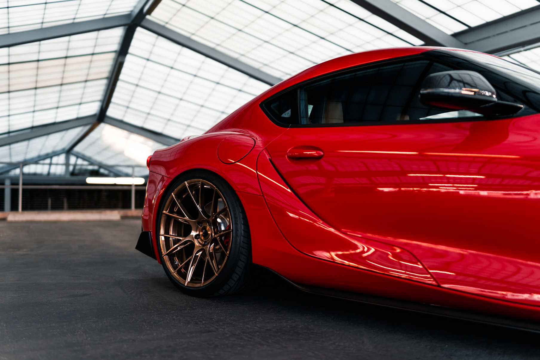 A 2020 Toyota Supra on Blaque Diamond BD-F18 Polished Bronze Little Tokyo Wheels