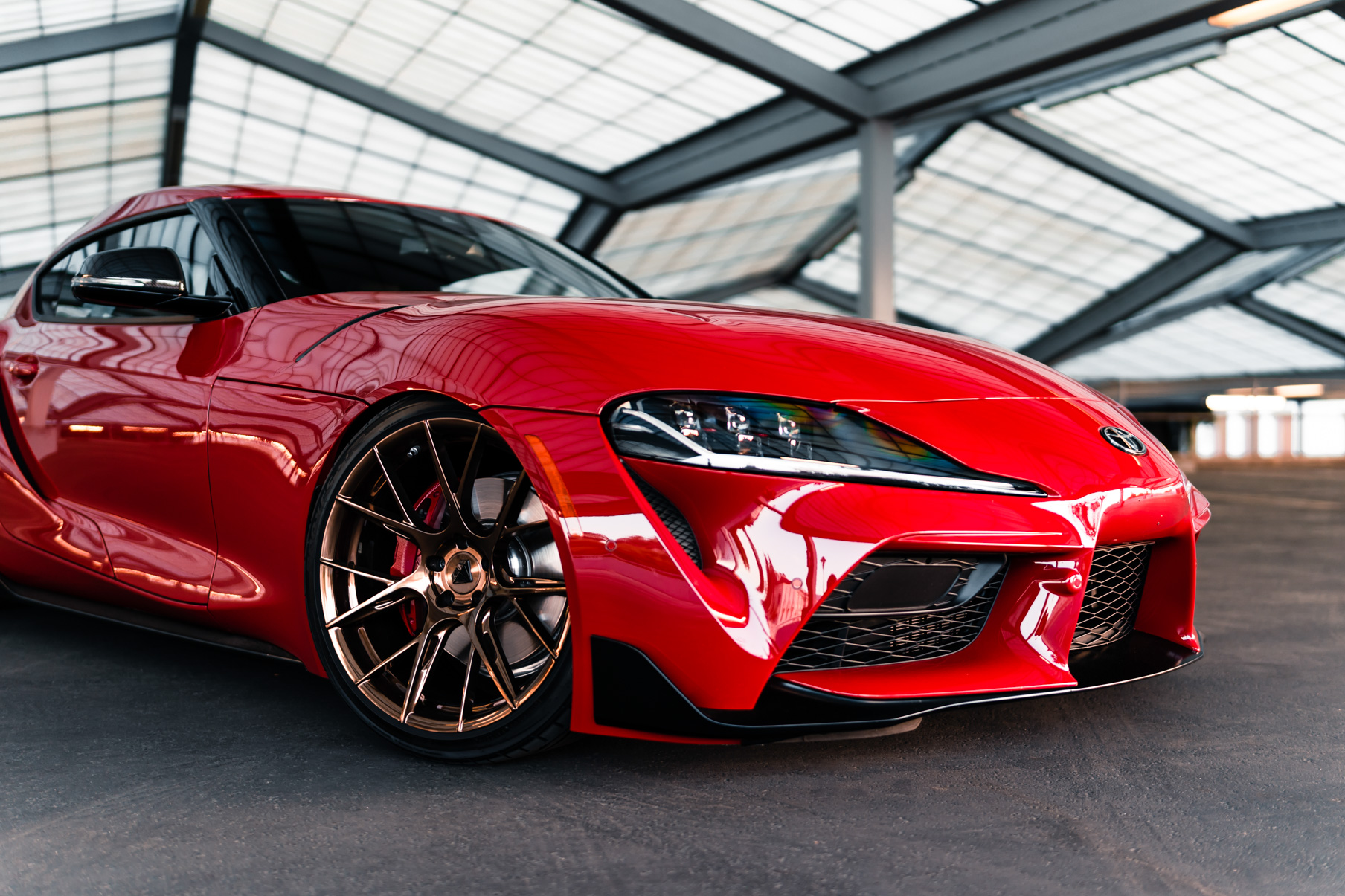 A 2020 Toyota Supra on Blaque Diamond BD-F18 Polished Bronze Little Tokyo Wheels