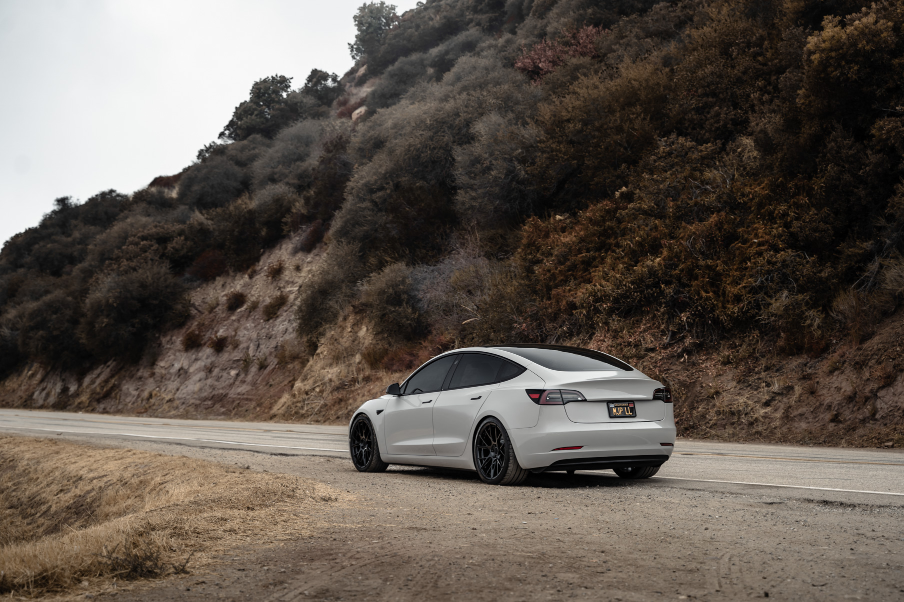 A 2020 Tesla Model 3 on 20 Inch Blaque Diamond BD-F18 Gloss Black Wheels