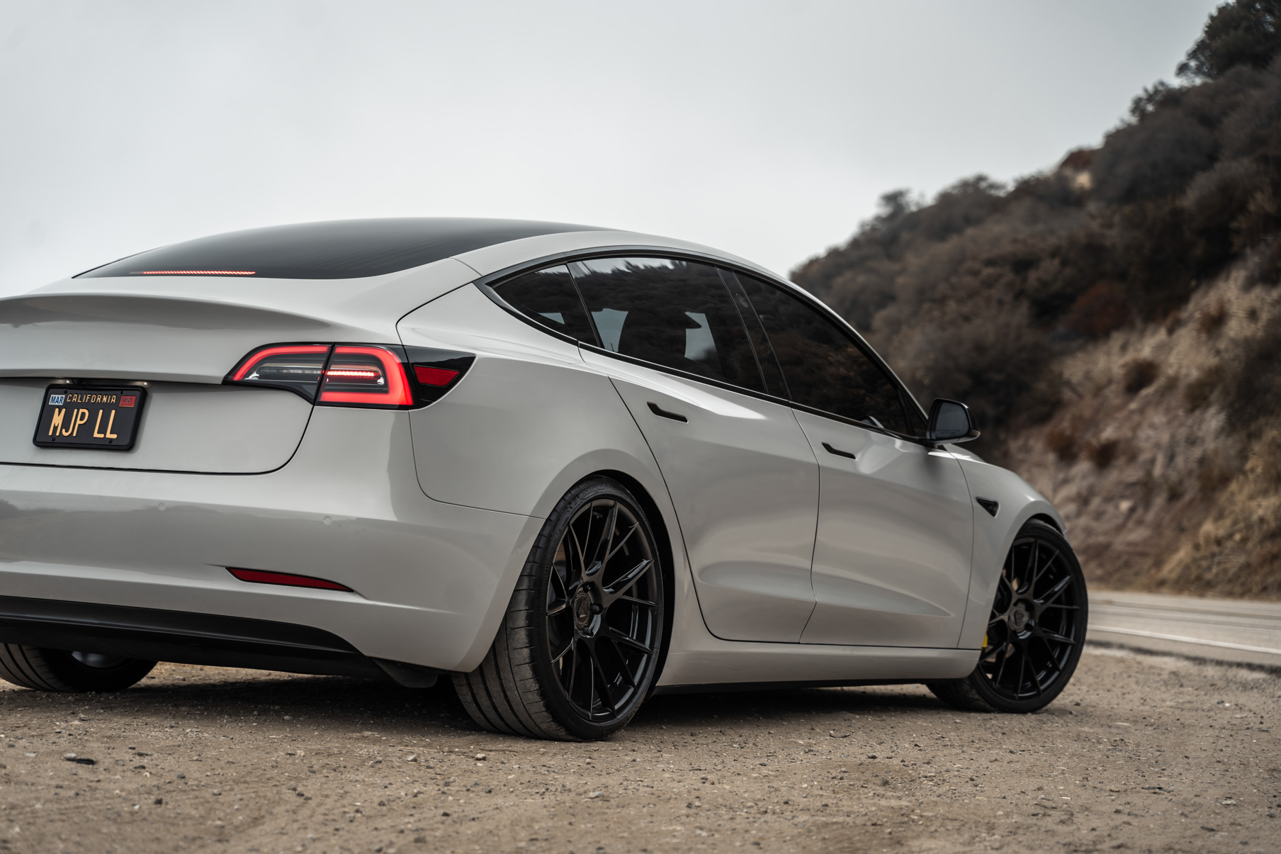 A 2020 Tesla Model 3 on 20 Inch Blaque Diamond BD-F18 Gloss Black Wheels