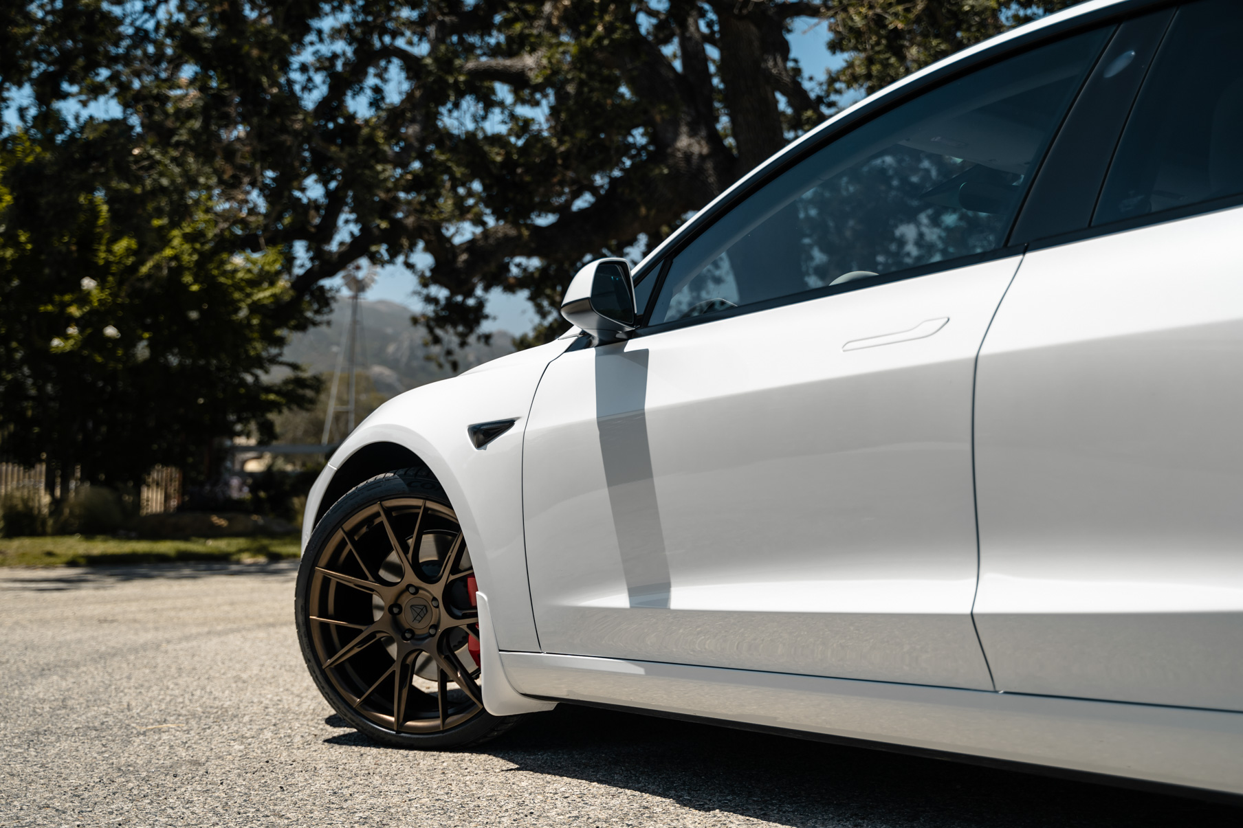 A 2019 Tesla Model 3 on 20 Inch Blaque Diamond BD-F18 Antique Matte Bronze Wheels