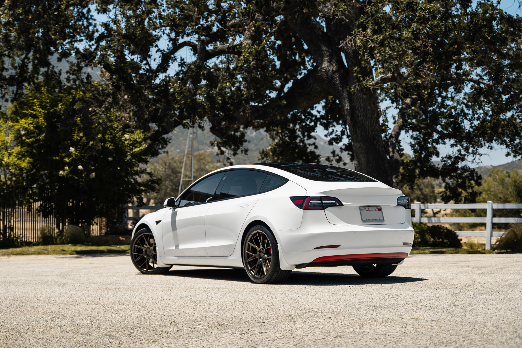 A 2019 Tesla Model 3 on 20 Inch Blaque Diamond BD-F18 Antique Matte Bronze Wheels