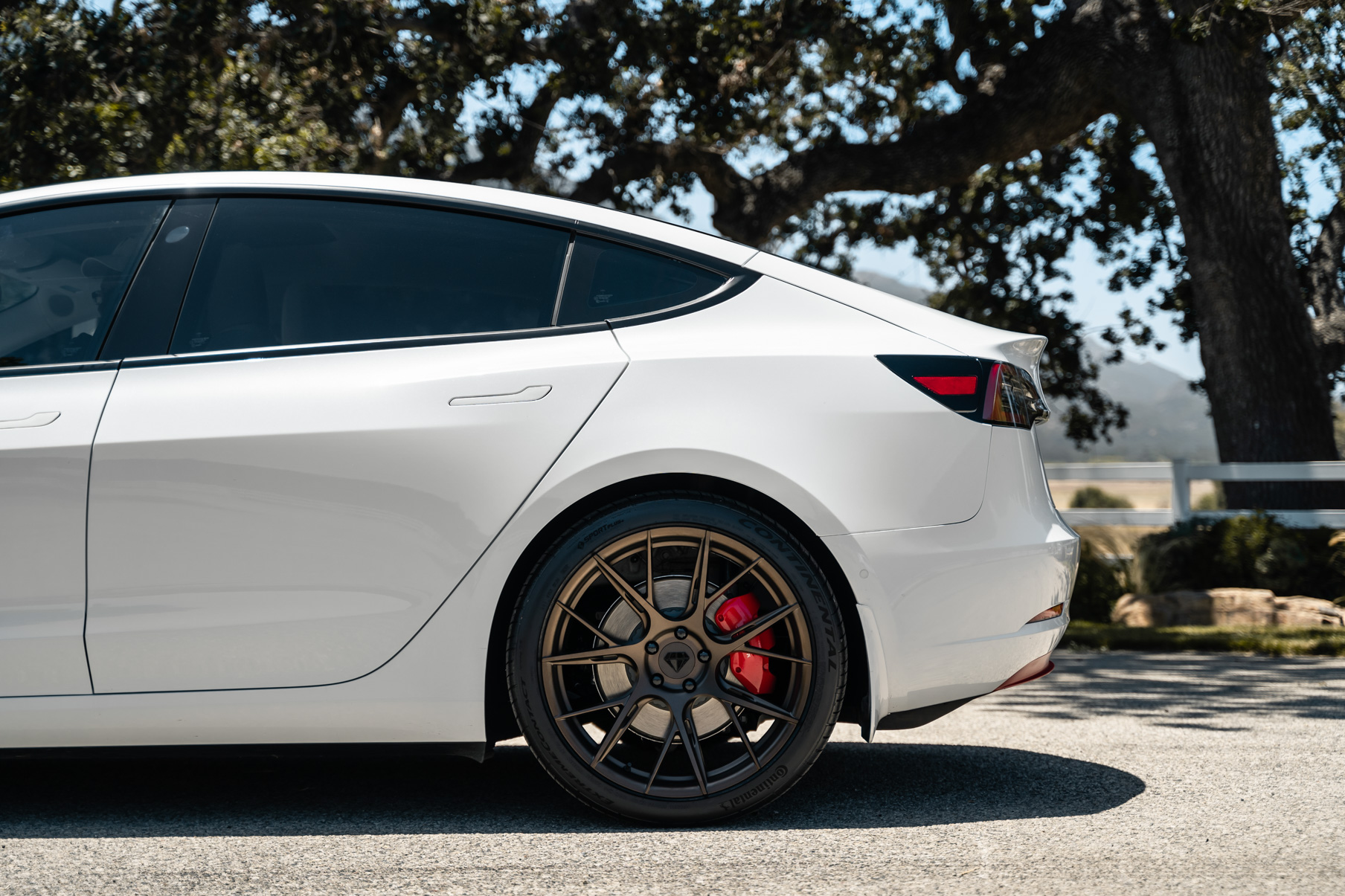 A 2019 Tesla Model 3 on 20 Inch Blaque Diamond BD-F18 Antique Matte Bronze Wheels