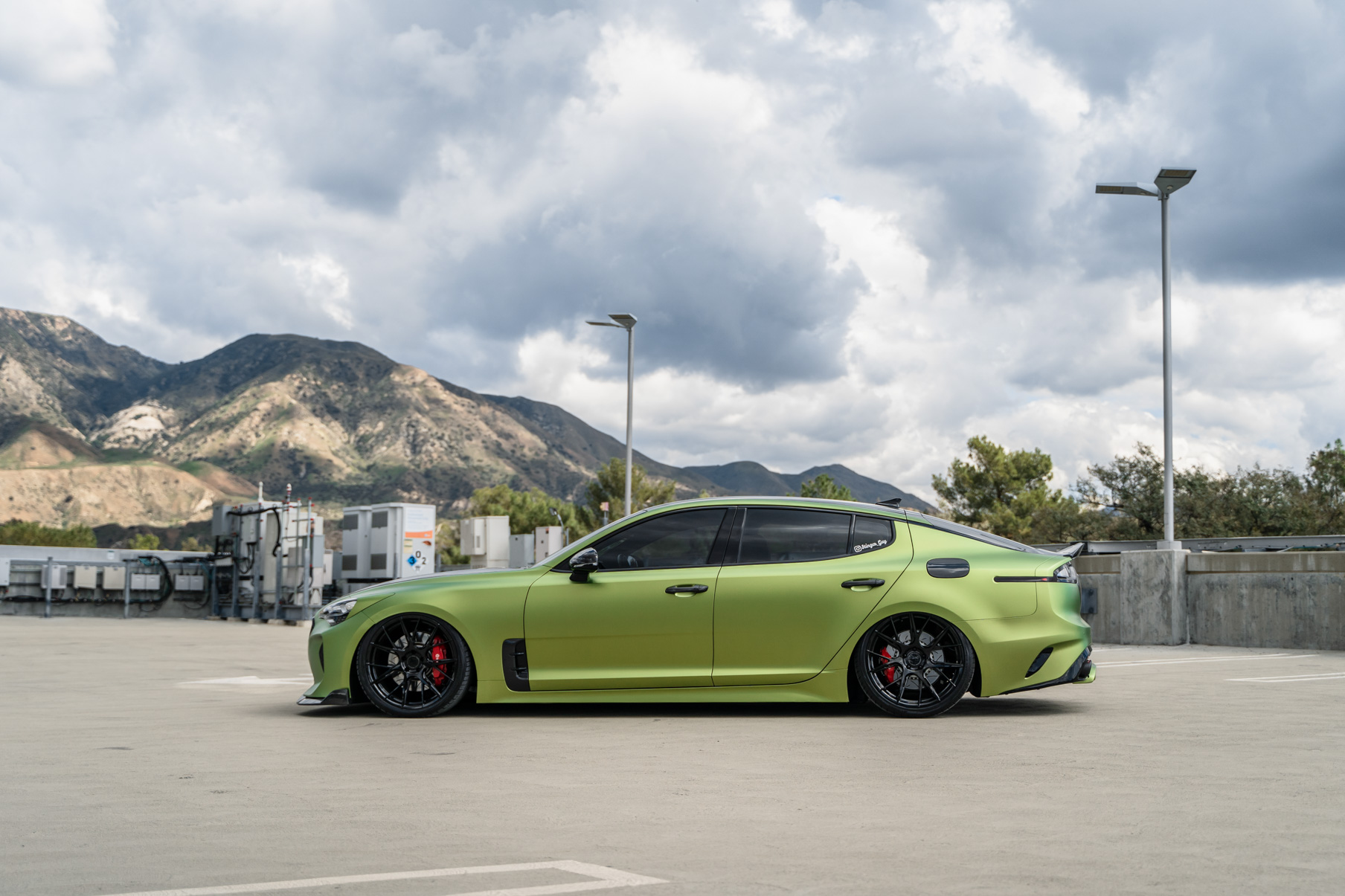 A 2019 Bagged Kia Stinger GT on 20 Inch Blaque Diamond BD-F18 Gloss Black Wheels