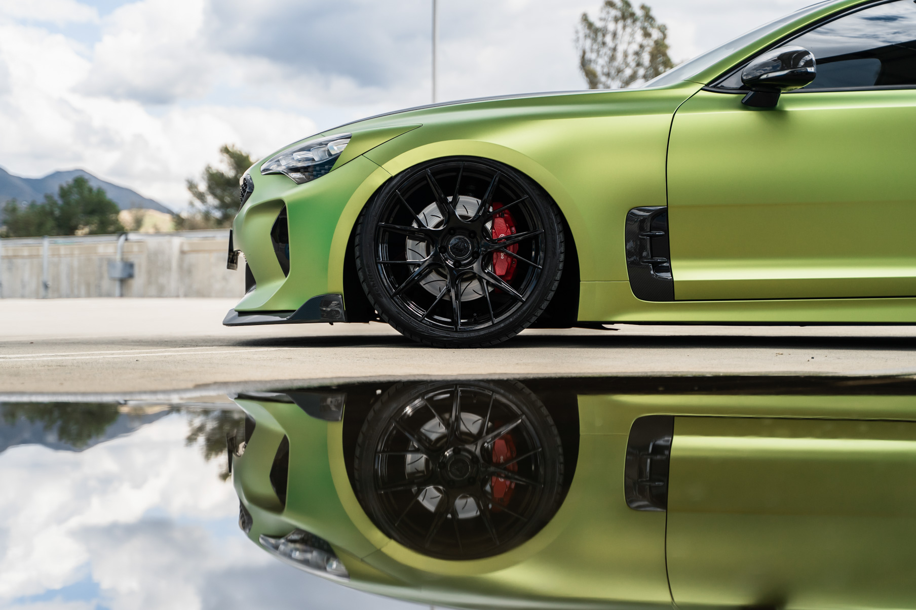 A 2019 Bagged Kia Stinger GT on 20 Inch Blaque Diamond BD-F18 Gloss Black Wheels