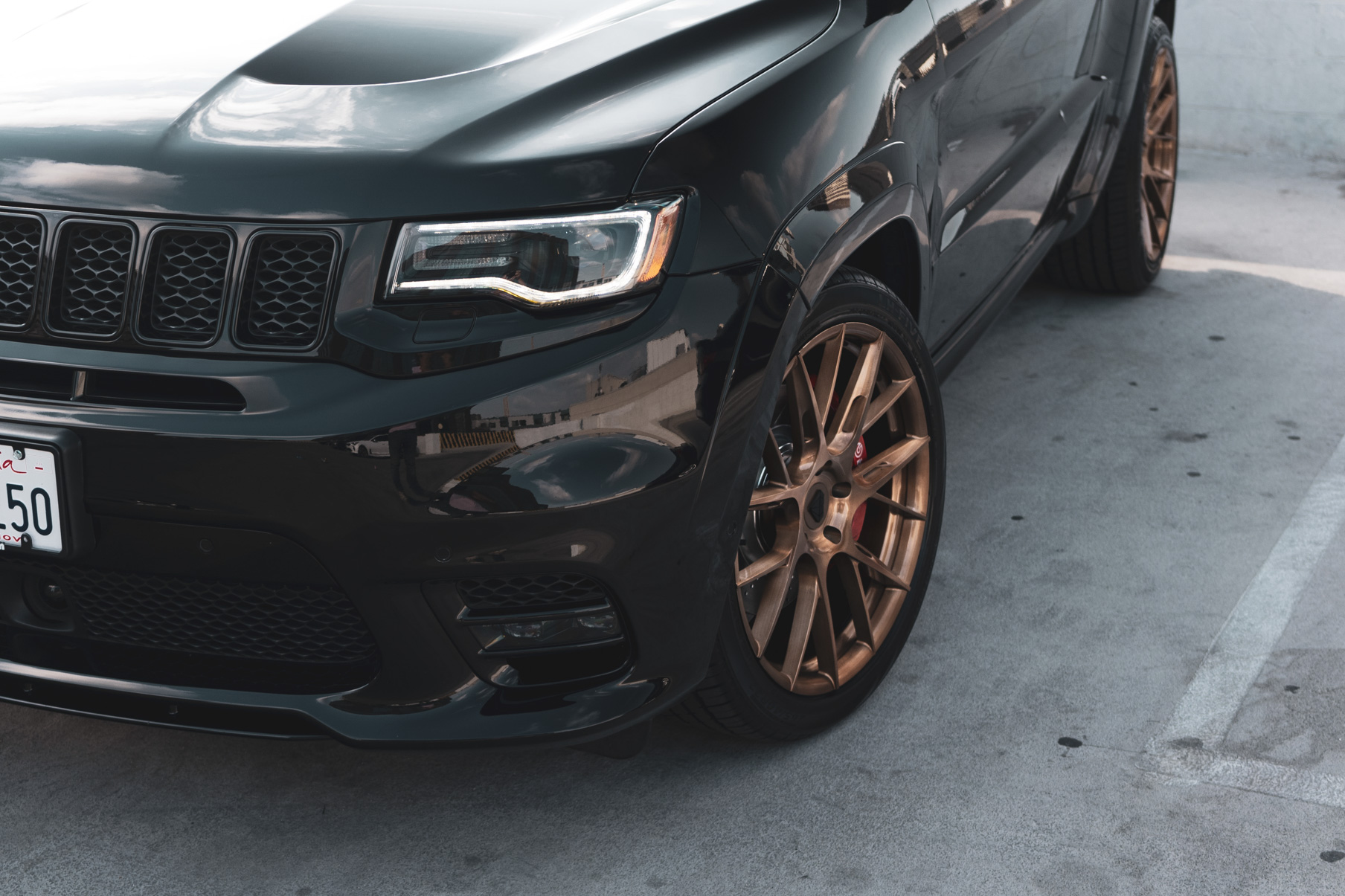 A 2020 Jeep SRT on 22 Inch Blaque Diamond Brushed Bronze Wheels