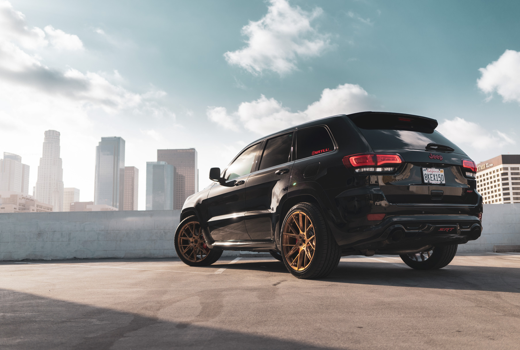 A 2020 Jeep SRT on 22 Inch Blaque Diamond Brushed Bronze Wheels