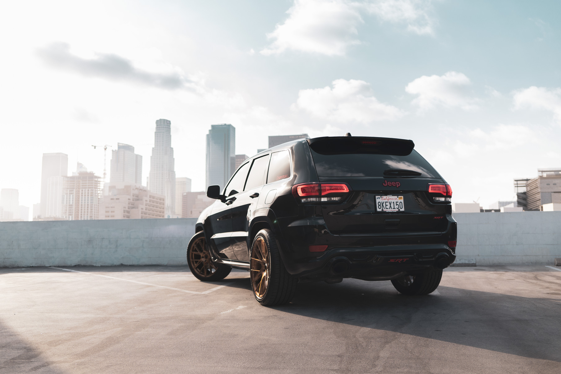 A 2020 Jeep SRT on 22 Inch Blaque Diamond Brushed Bronze Wheels