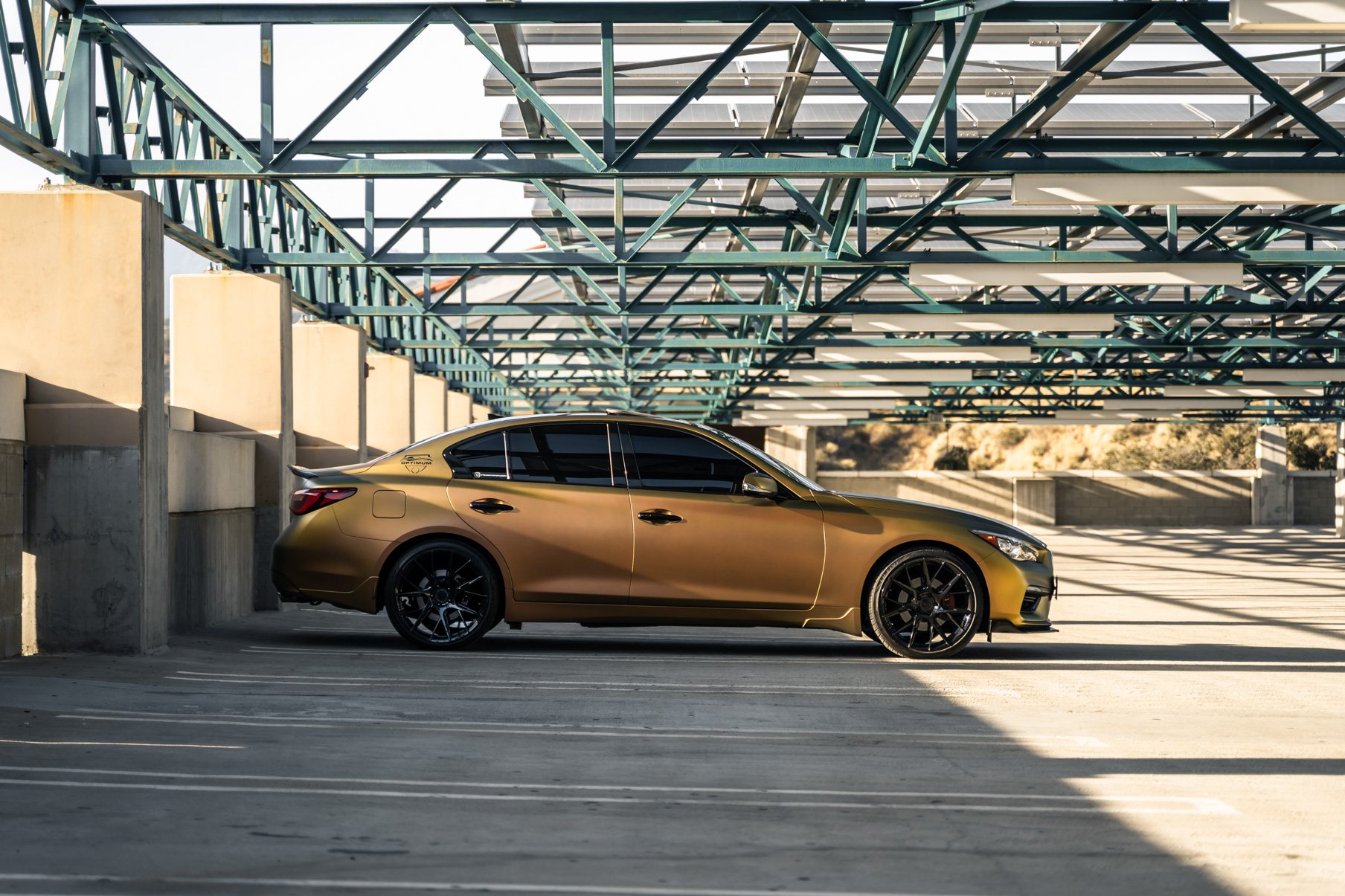 A Gold 2018 Infiniti Q50 on 20 Inch Blaque Diamond BD-F18 Gloss Black Wheels