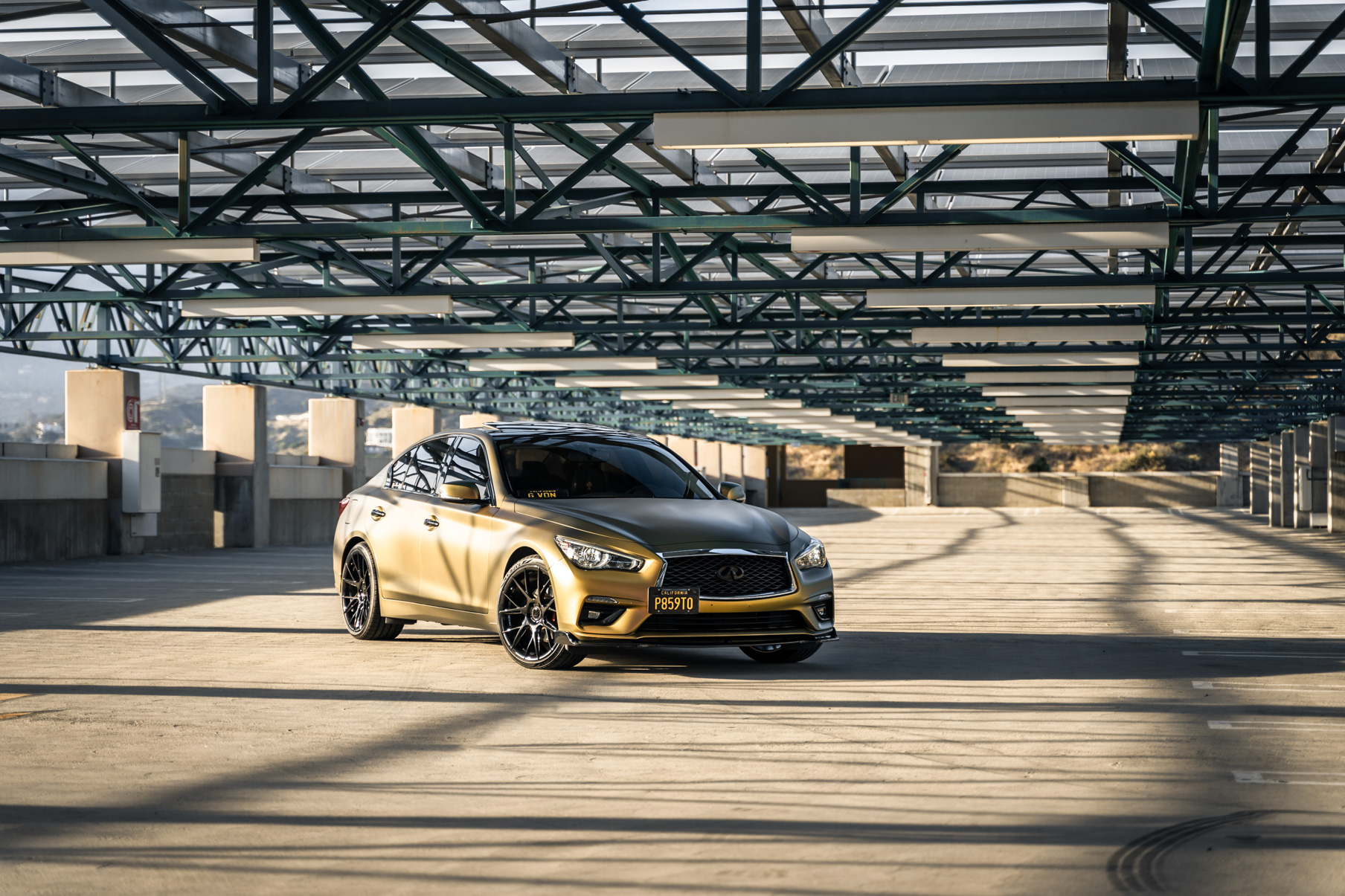 A Gold 2018 Infiniti Q50 on 20 Inch Blaque Diamond BD-F18 Gloss Black Wheels
