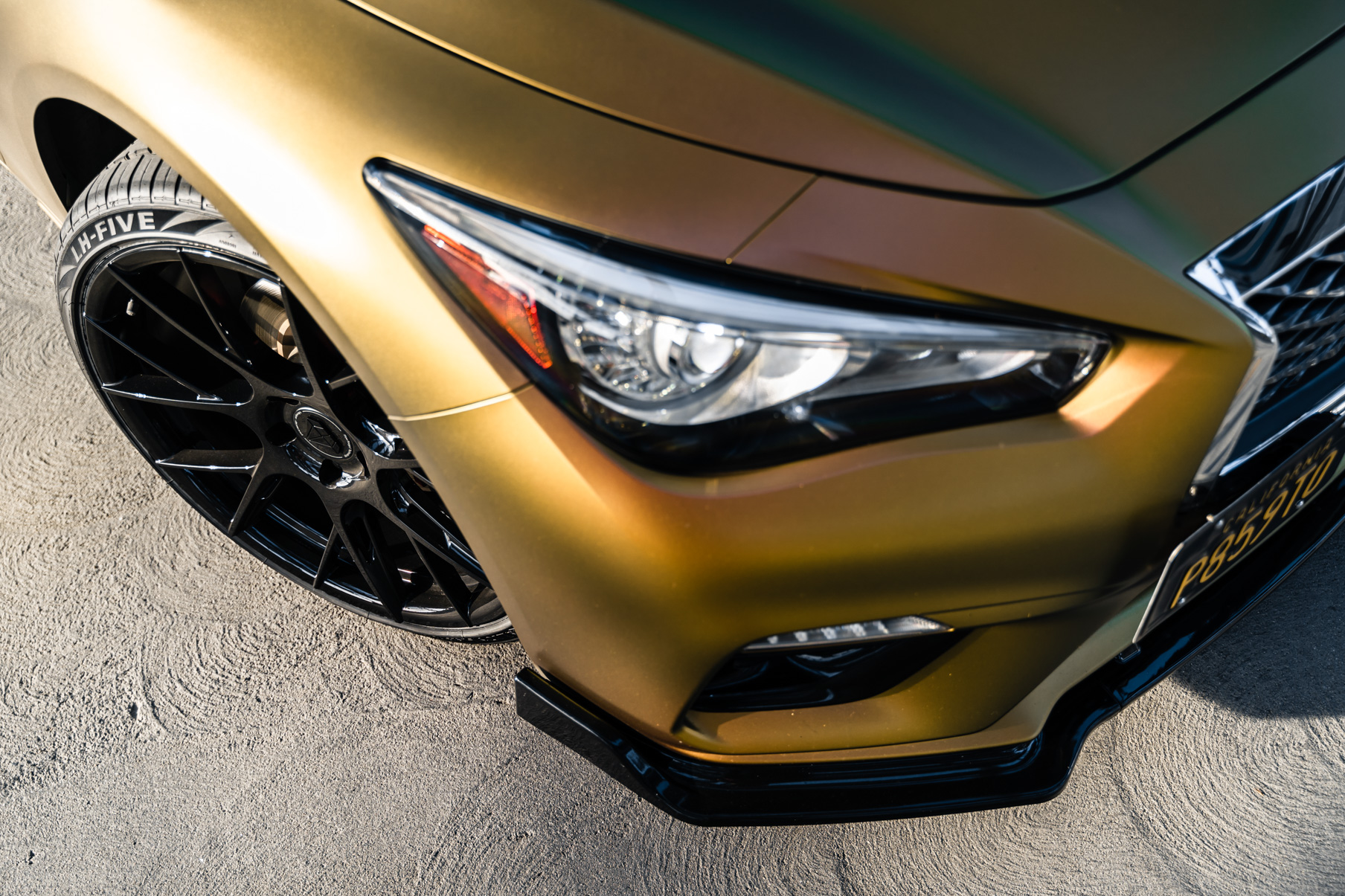 A Gold 2018 Infiniti Q50 on 20 Inch Blaque Diamond BD-F18 Gloss Black Wheels