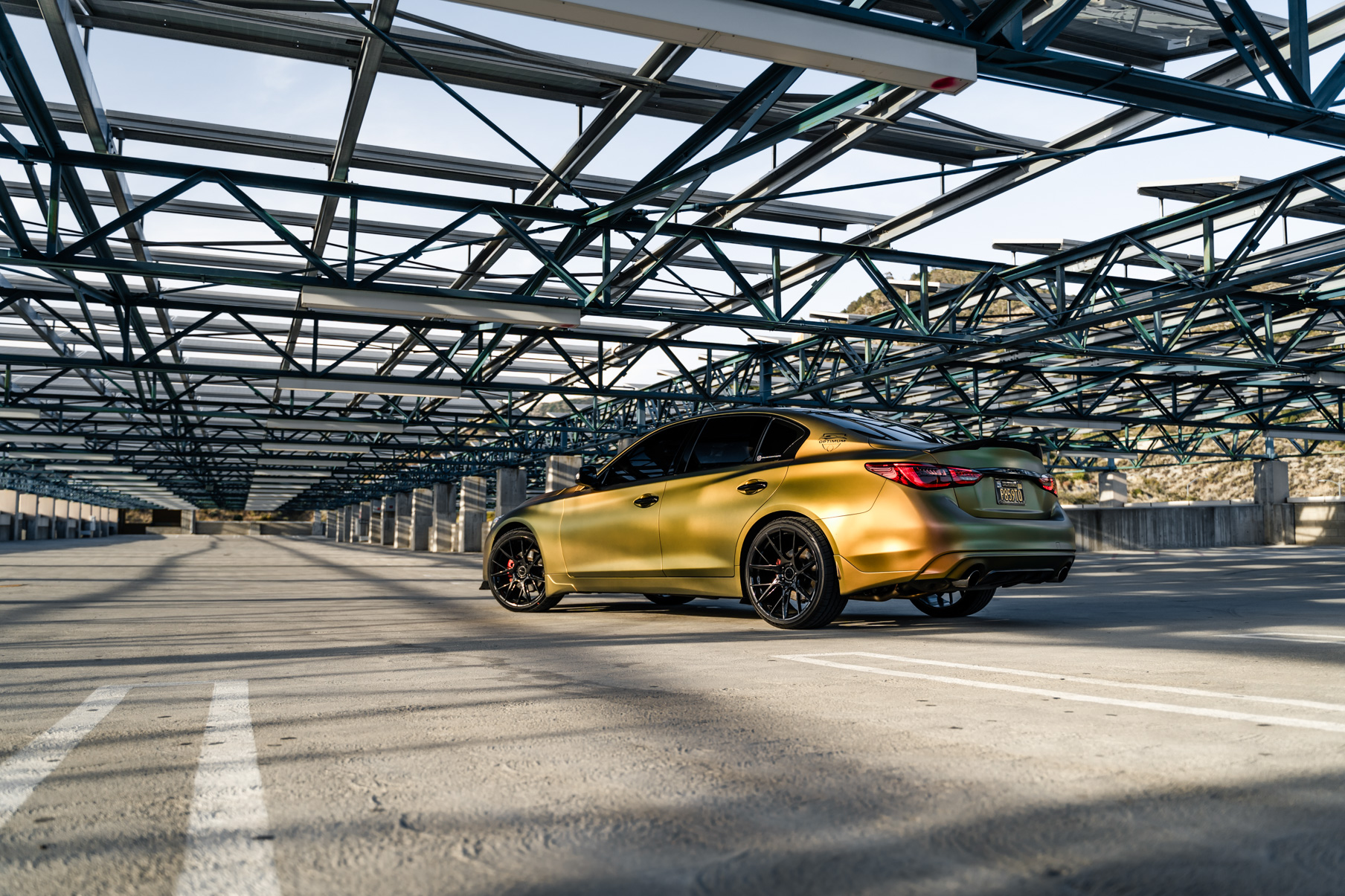 A Gold 2018 Infiniti Q50 on 20 Inch Blaque Diamond BD-F18 Gloss Black Wheels